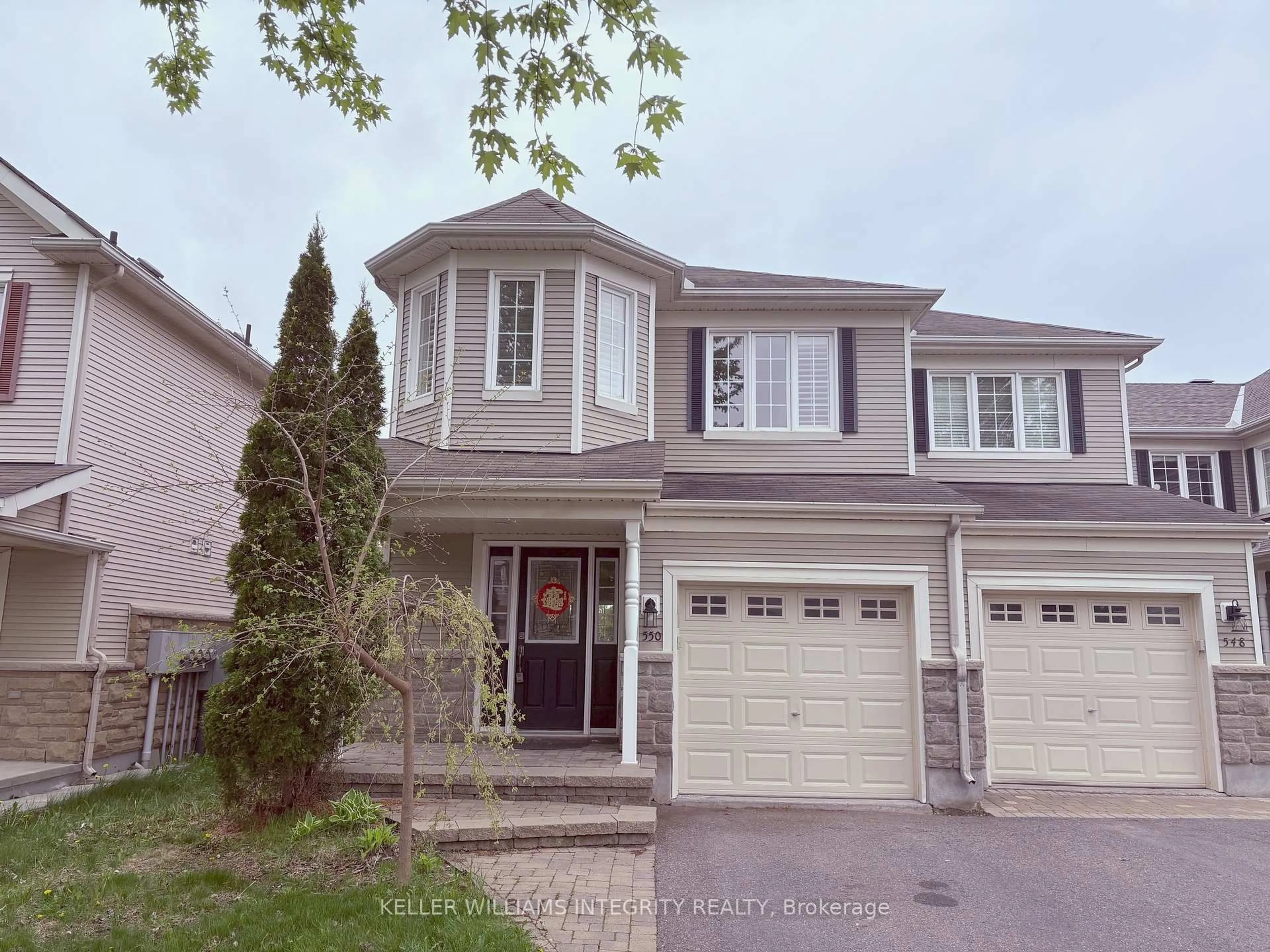 Home with vinyl exterior material, street for 550 Ashbourne Cres Cres, Ottawa Ontario K2J 0P6