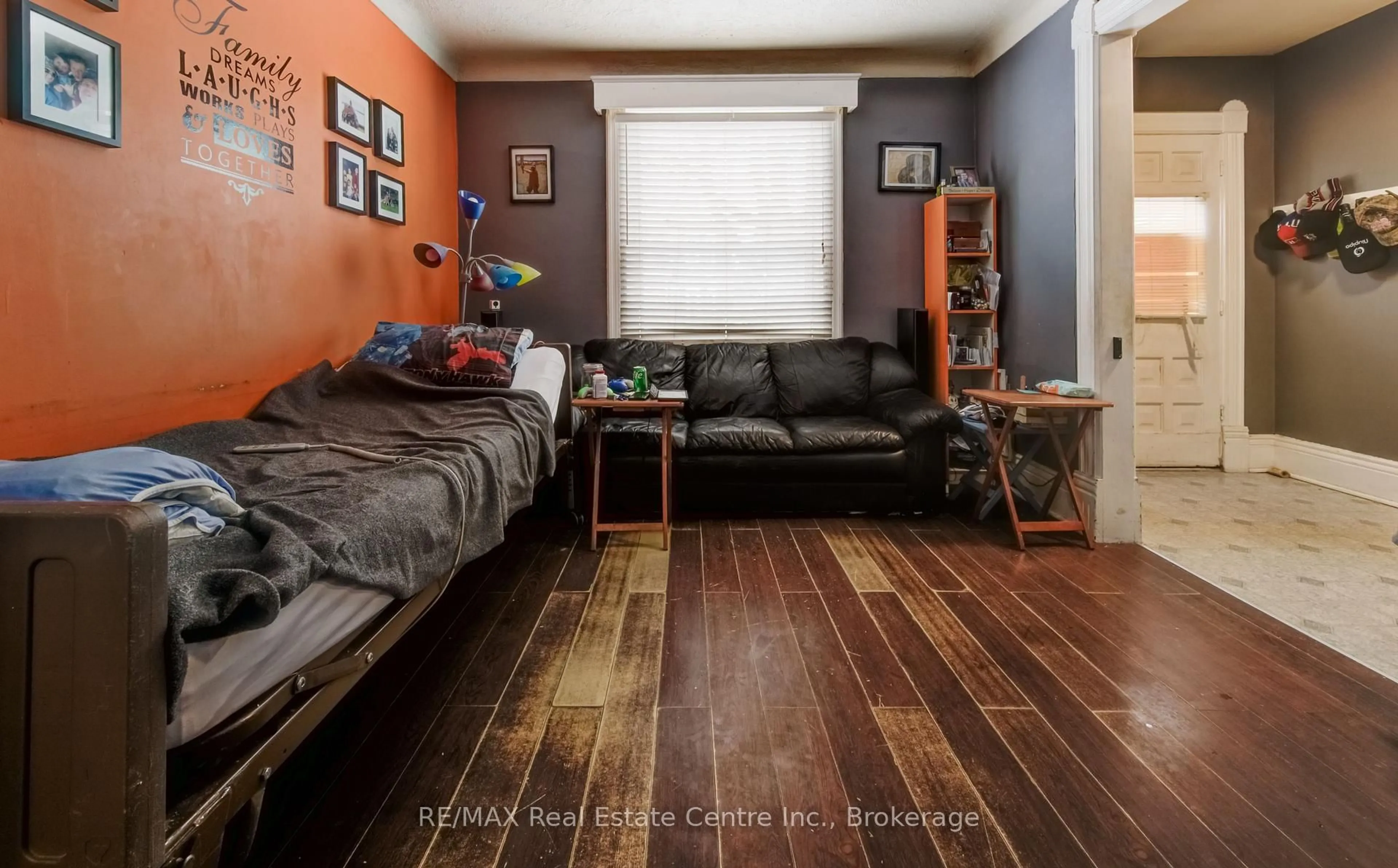 Living room with furniture, wood/laminate floor for 46 Port St, Brantford Ontario N3S 1Y2