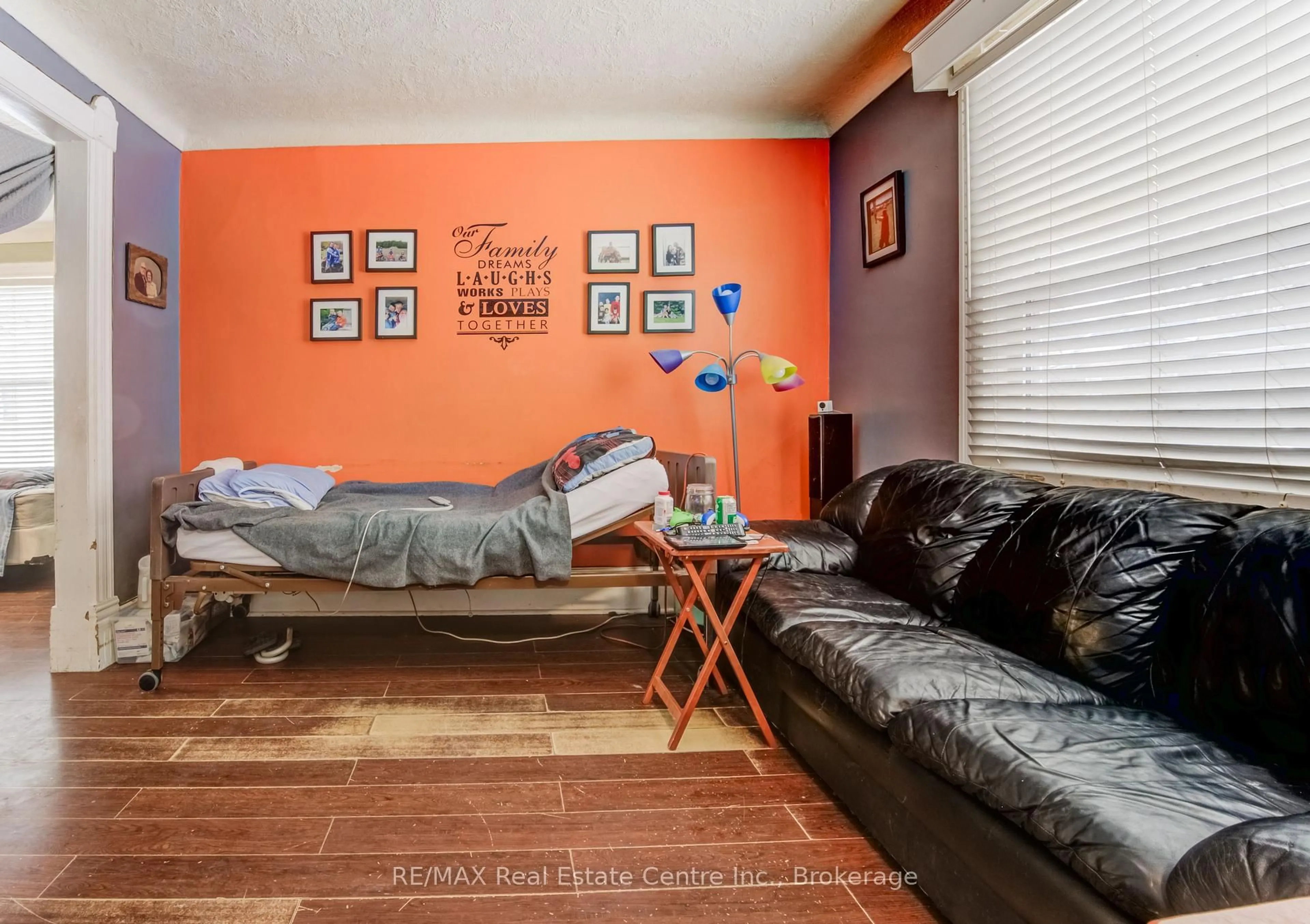 Living room with furniture, wood/laminate floor for 46 Port St, Brantford Ontario N3S 1Y2