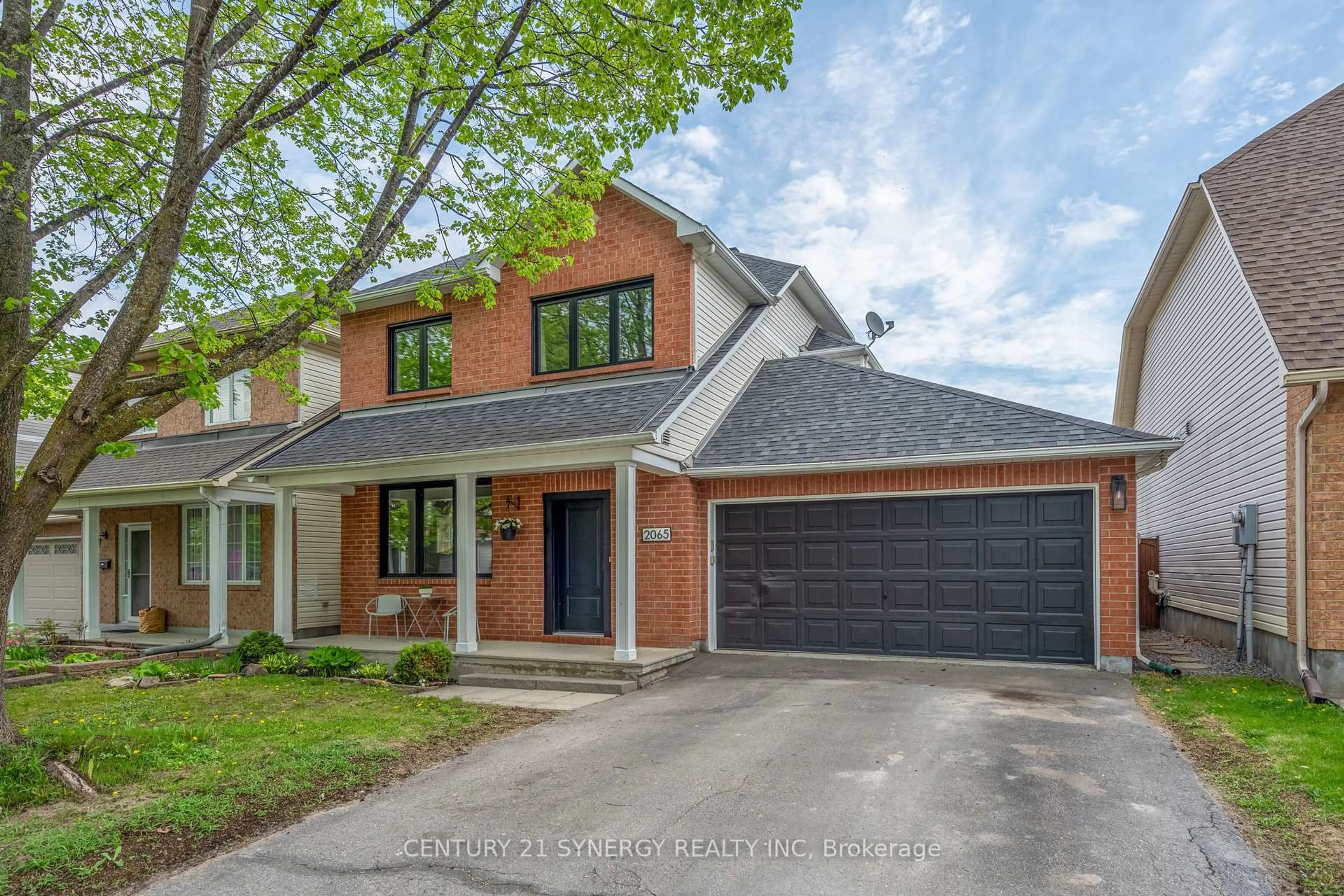 Home with brick exterior material, street for 2065 Oakbrook Circ, Ottawa Ontario K1W 1H4