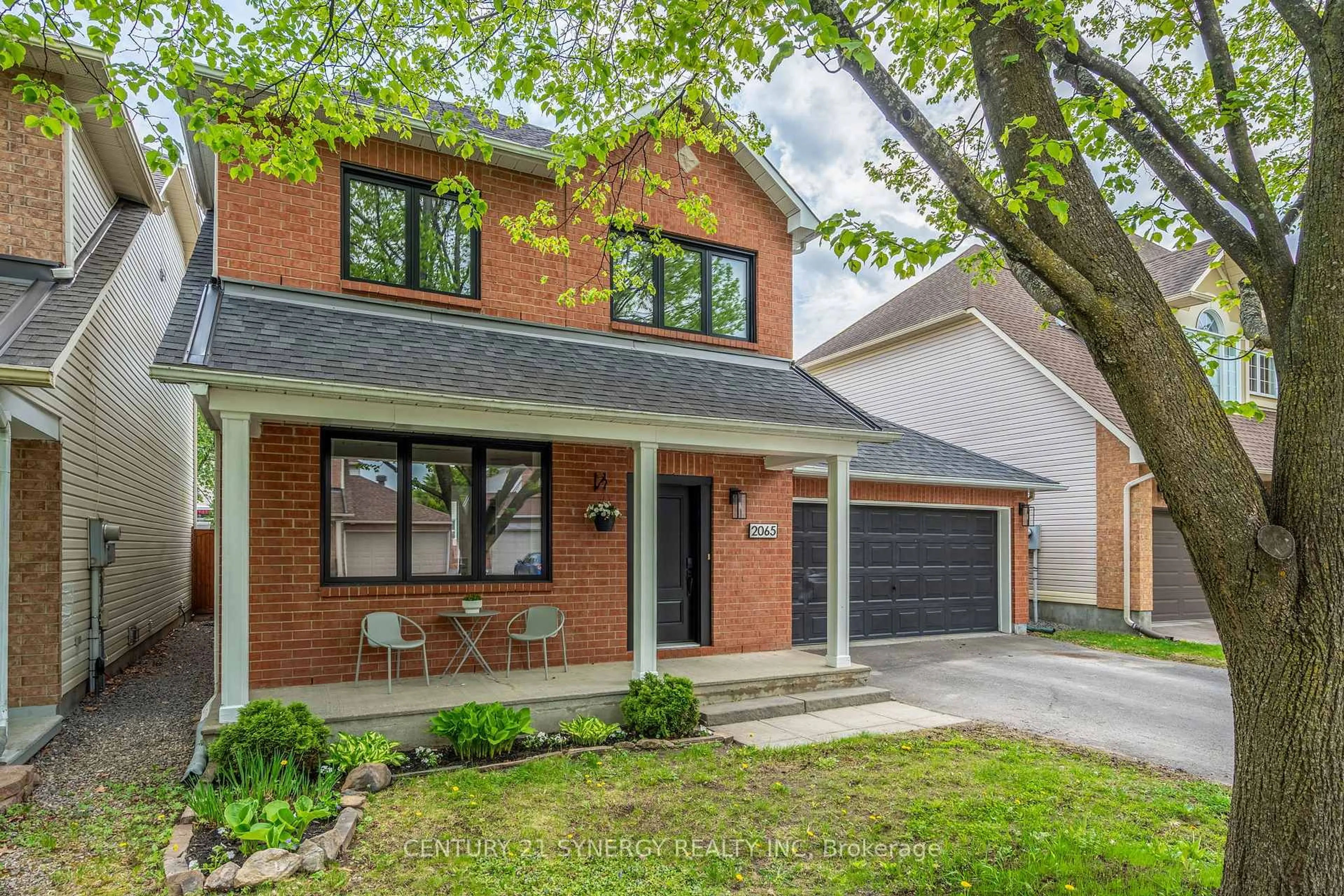 Home with brick exterior material, street for 2065 Oakbrook Circ, Ottawa Ontario K1W 1H4