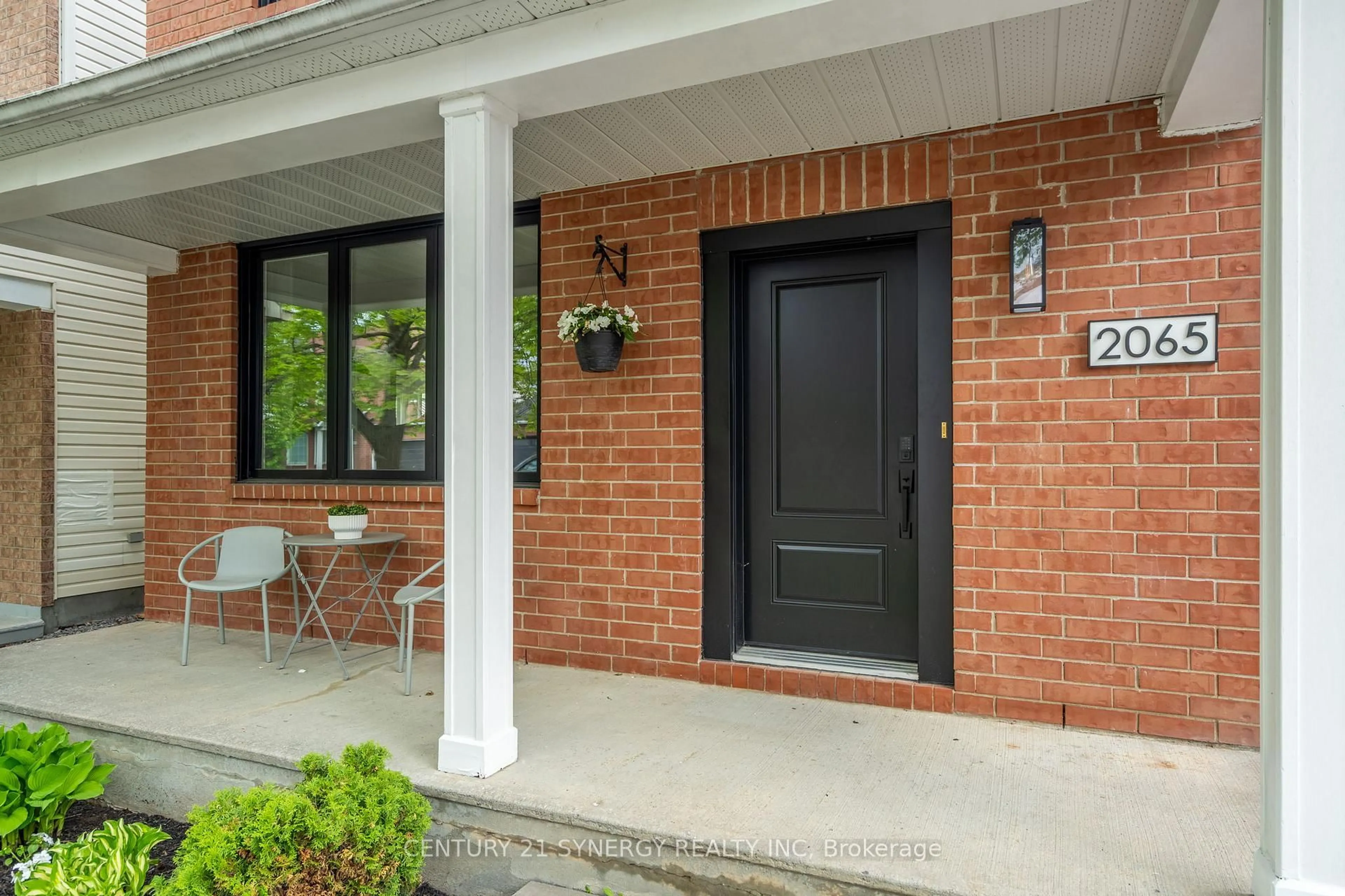 Home with brick exterior material, street for 2065 Oakbrook Circ, Ottawa Ontario K1W 1H4