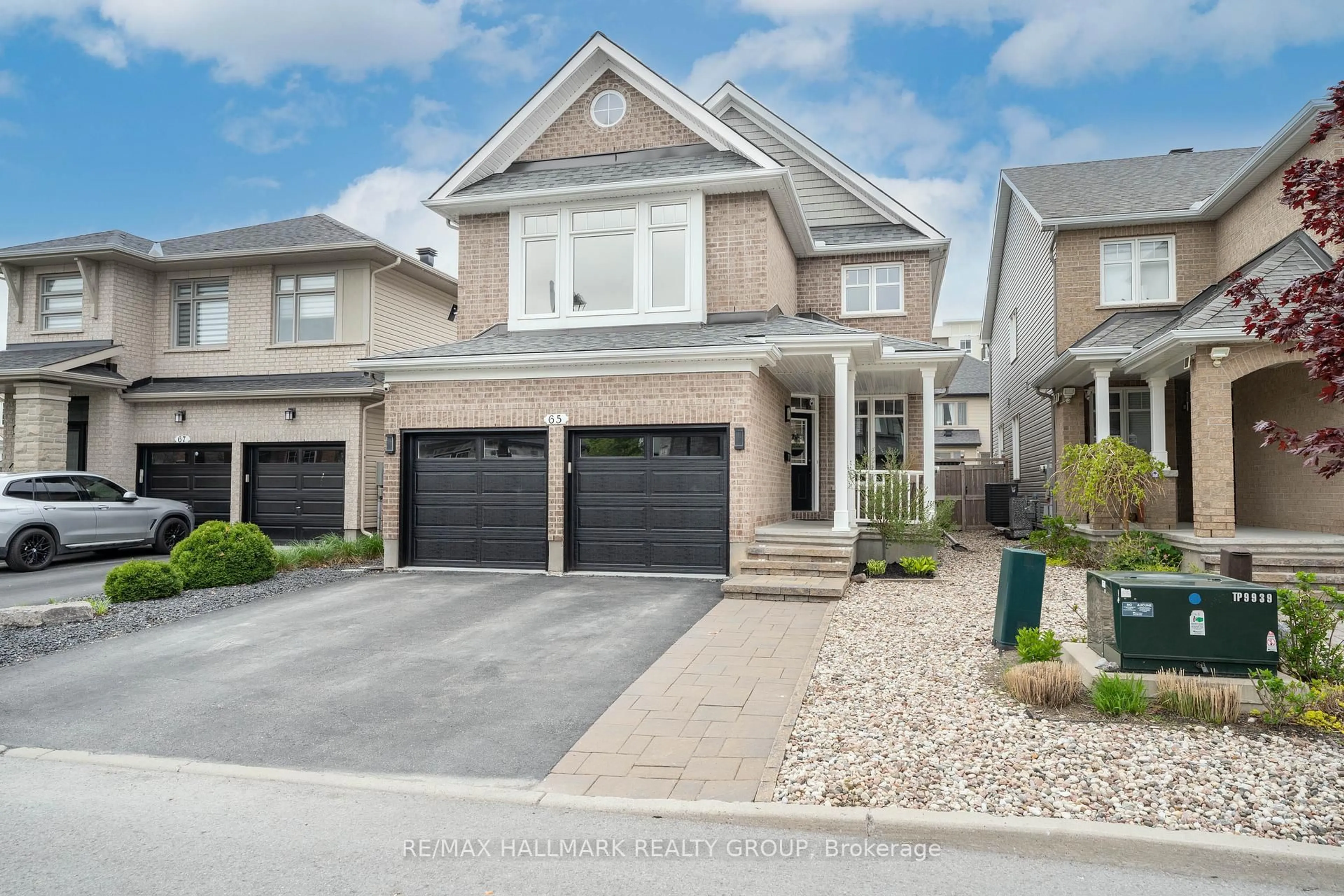 Home with brick exterior material, street for 65 Ginseng Terr, Stittsville Ontario K2V 0B5