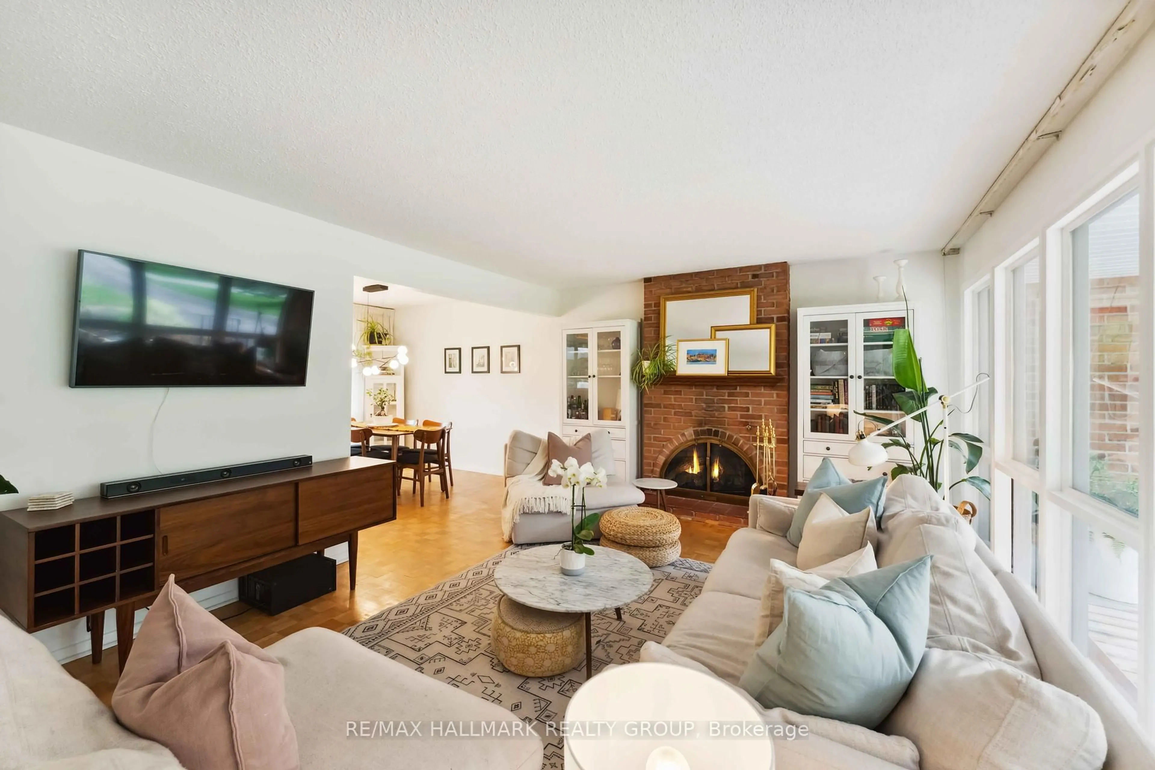 Living room with furniture, wood/laminate floor for 54 Lismer Cres, Kanata Ontario K2K 1A2