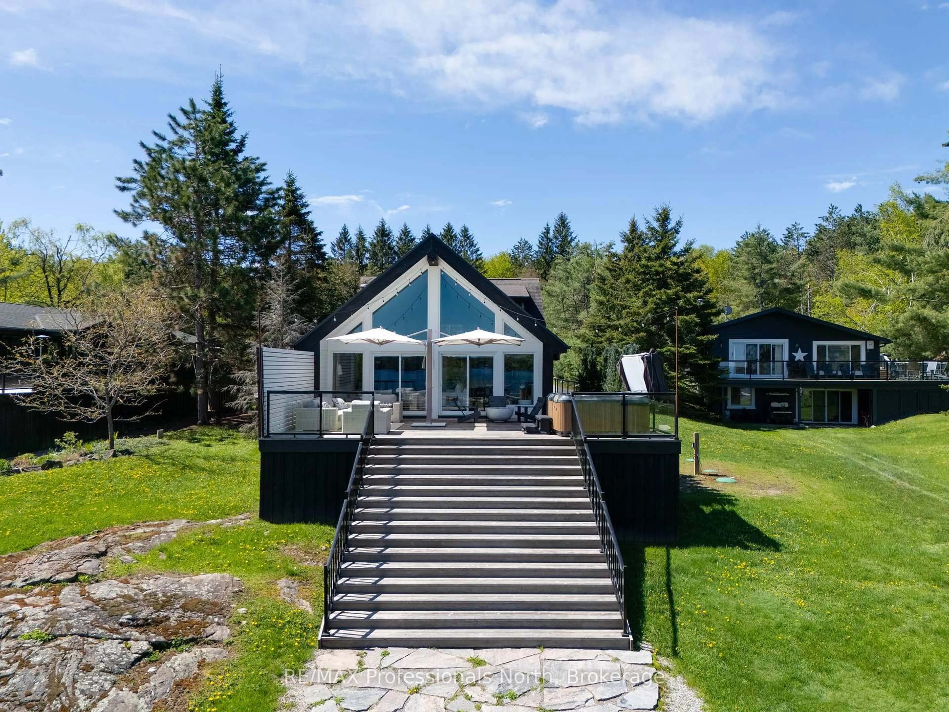 A pic from outside/outdoor area/front of a property/back of a property/a pic from drone, water/lake/river/ocean view for 1059 Woodington Rd #6, Muskoka Lakes Ontario P0B 1J0