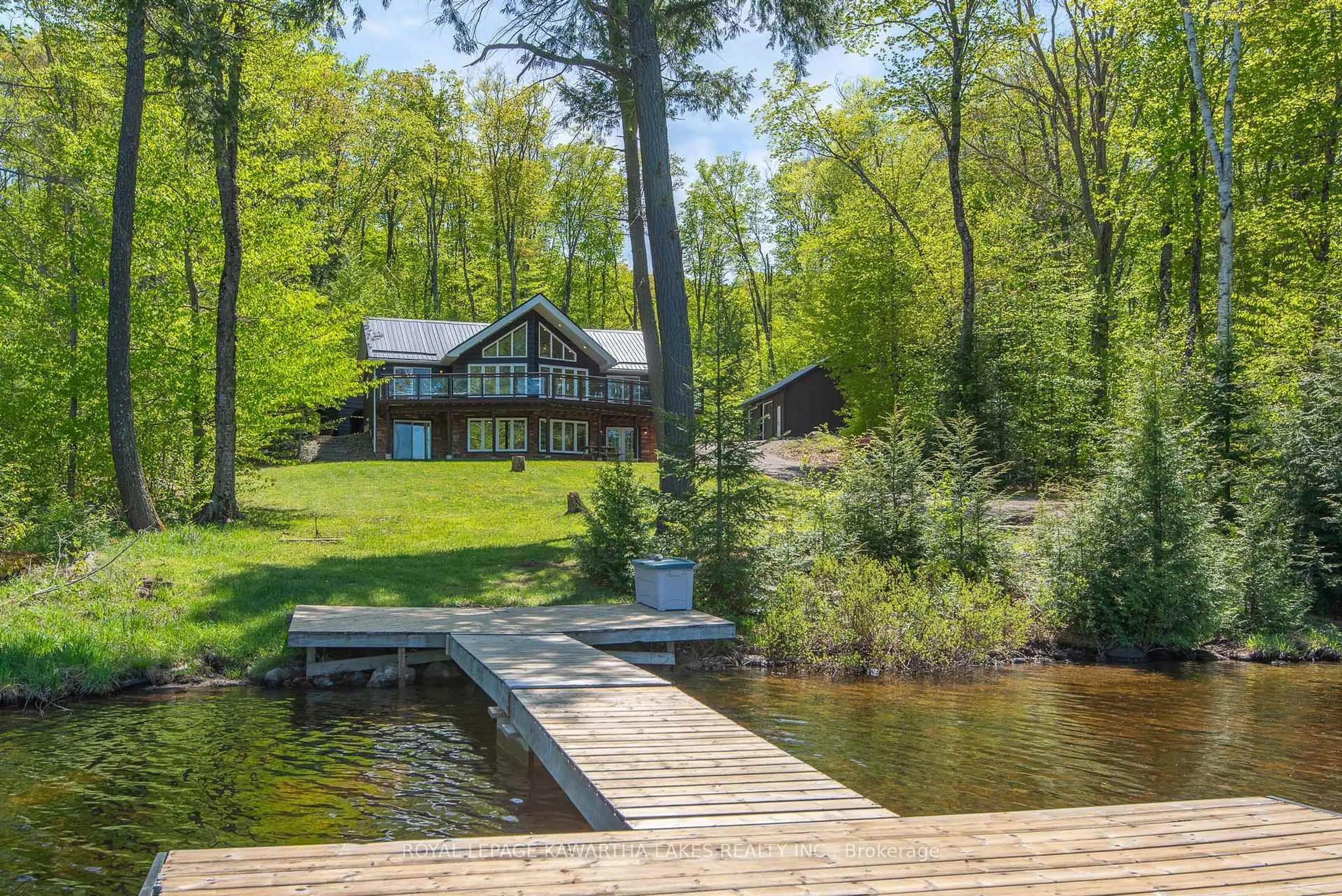 A pic from outside/outdoor area/front of a property/back of a property/a pic from drone, water/lake/river/ocean view for 1307 Adanac Rd, Highlands East Ontario K0L 1M0