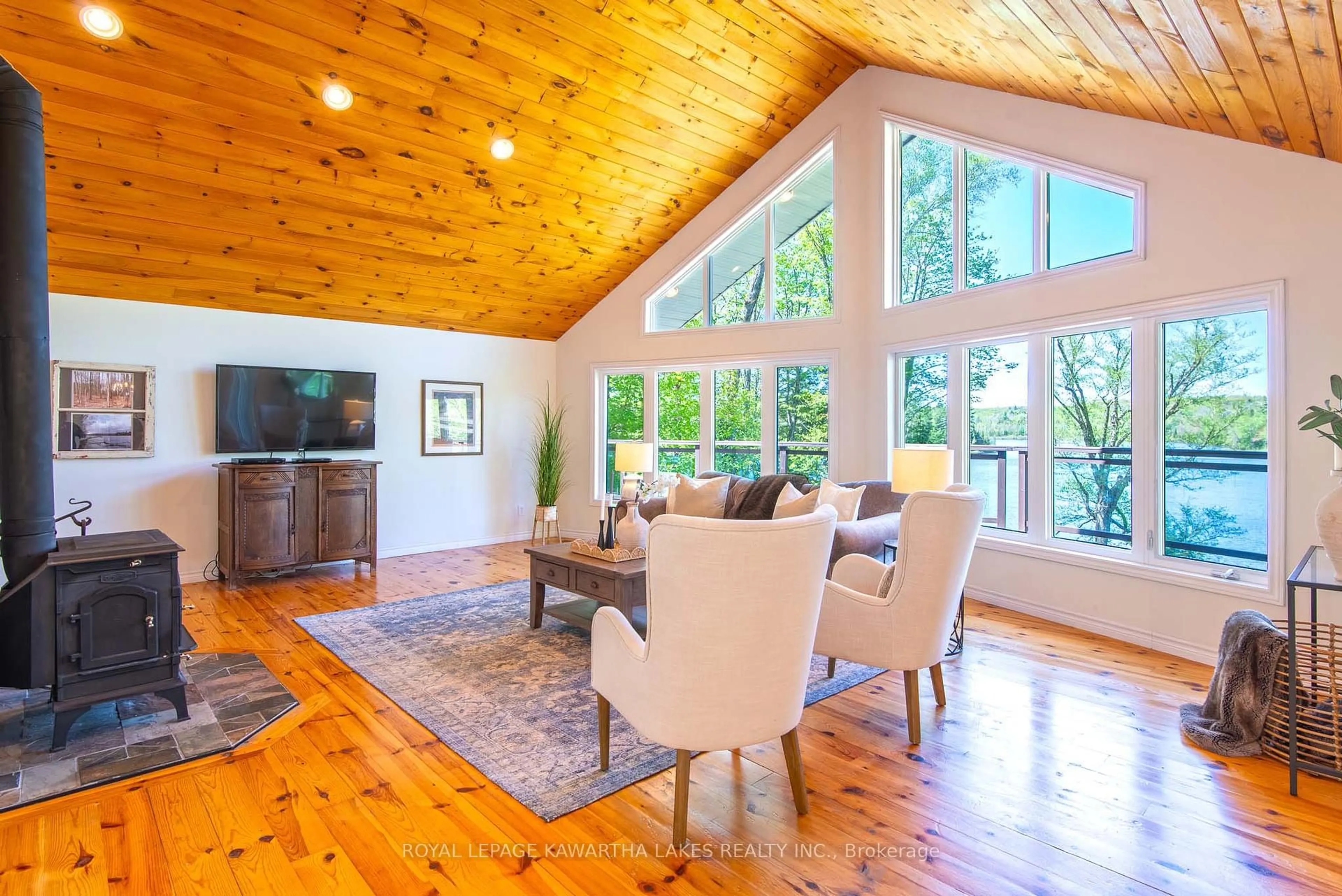 Living room with furniture, wood/laminate floor for 1307 Adanac Rd, Highlands East Ontario K0L 1M0