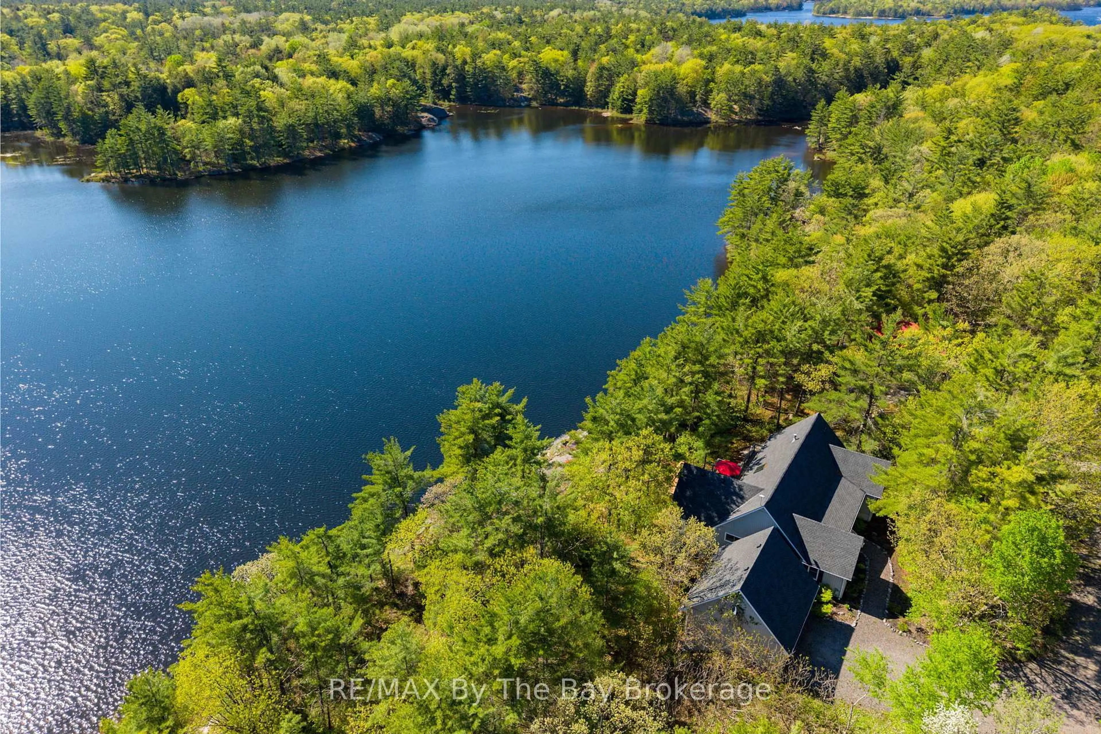 A pic from outside/outdoor area/front of a property/back of a property/a pic from drone, water/lake/river/ocean view for 261 Kim T Lane, Georgian Bay Ontario L0K 1S0