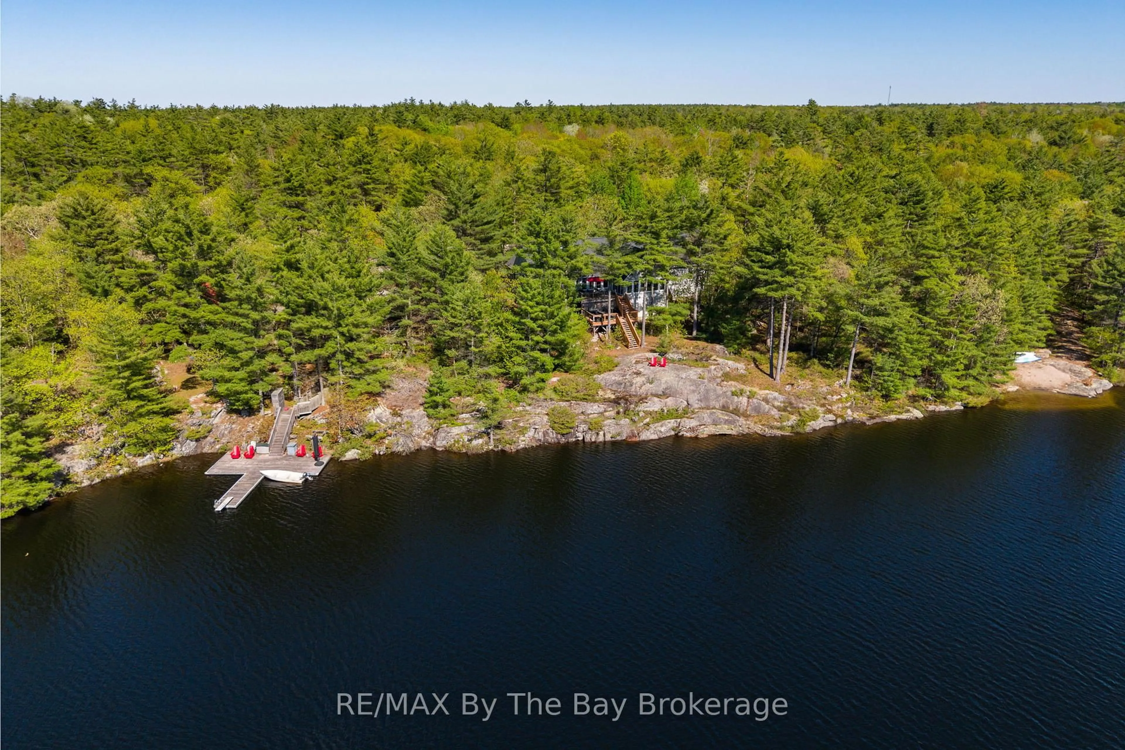 A pic from outside/outdoor area/front of a property/back of a property/a pic from drone, water/lake/river/ocean view for 261 Kim T Lane, Georgian Bay Ontario L0K 1S0
