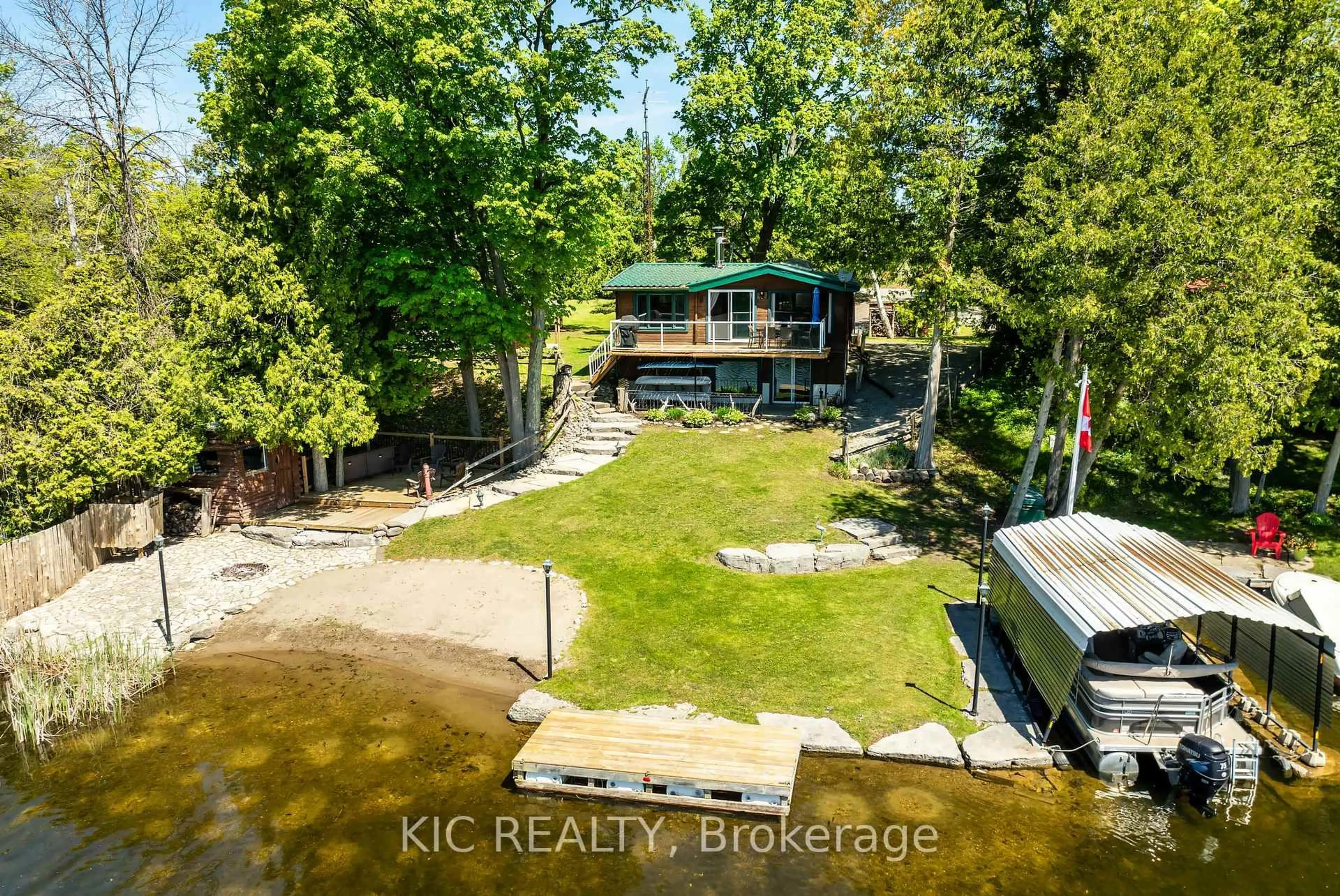 A pic from outside/outdoor area/front of a property/back of a property/a pic from drone, water/lake/river/ocean view for 4 Fire Route 61 Rte, Trent Lakes Ontario K0L 1J0