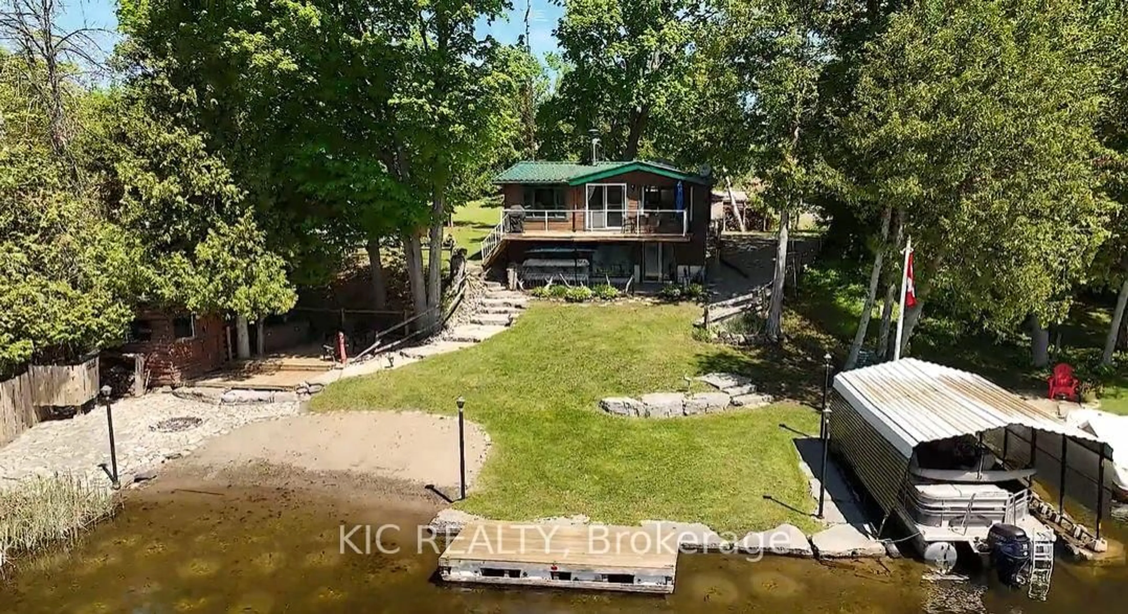 A pic from outside/outdoor area/front of a property/back of a property/a pic from drone, water/lake/river/ocean view for 4 Fire Route 61 Rte, Trent Lakes Ontario K0L 1J0