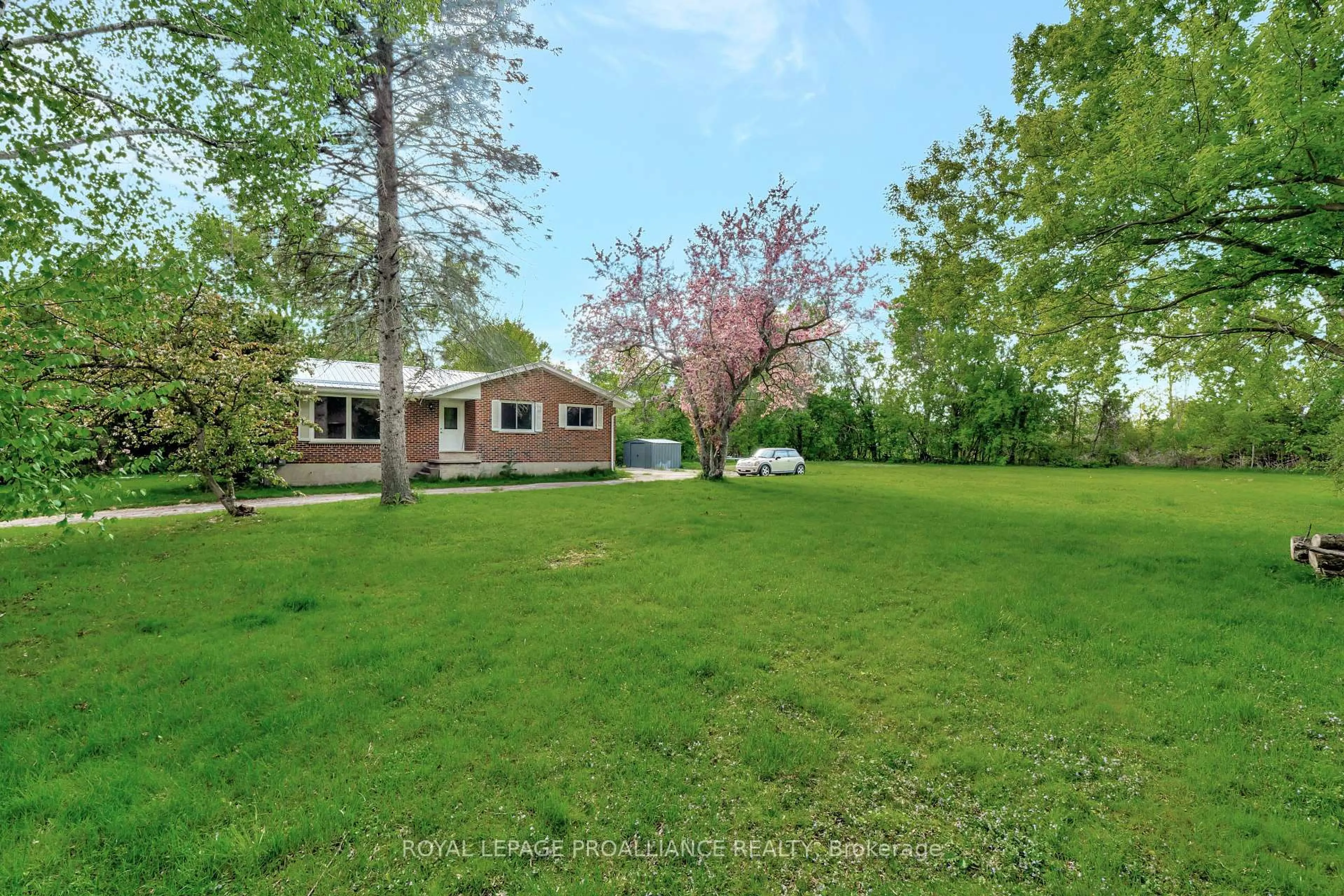 A pic from outside/outdoor area/front of a property/back of a property/a pic from drone, water/lake/river/ocean view for 709 Old Highway 2 Highway, Quinte West Ontario K8V 5P5