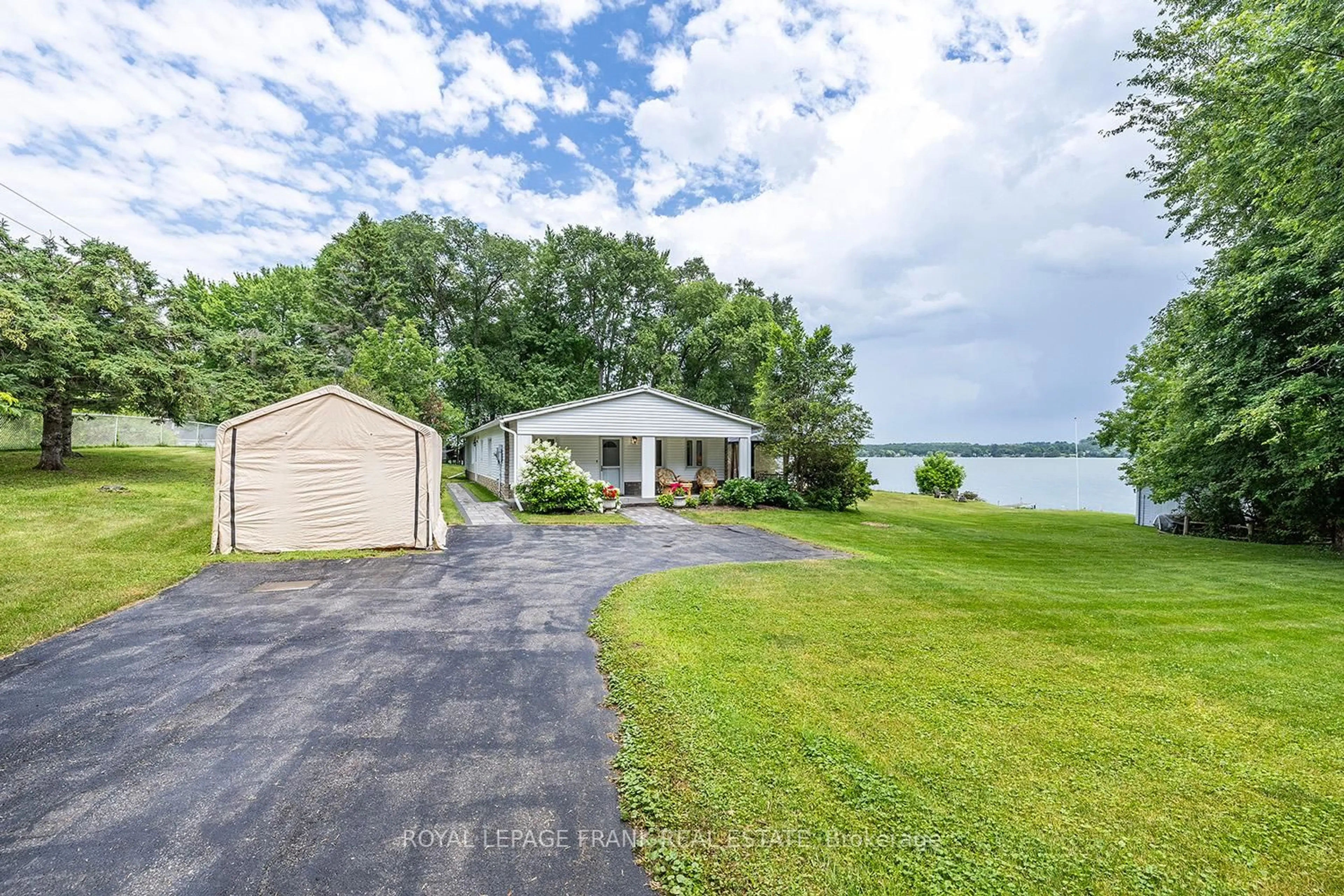 A pic from outside/outdoor area/front of a property/back of a property/a pic from drone, water/lake/river/ocean view for 46 LAKEVIEW Blvd, Kawartha Lakes Ontario K0M 2C0