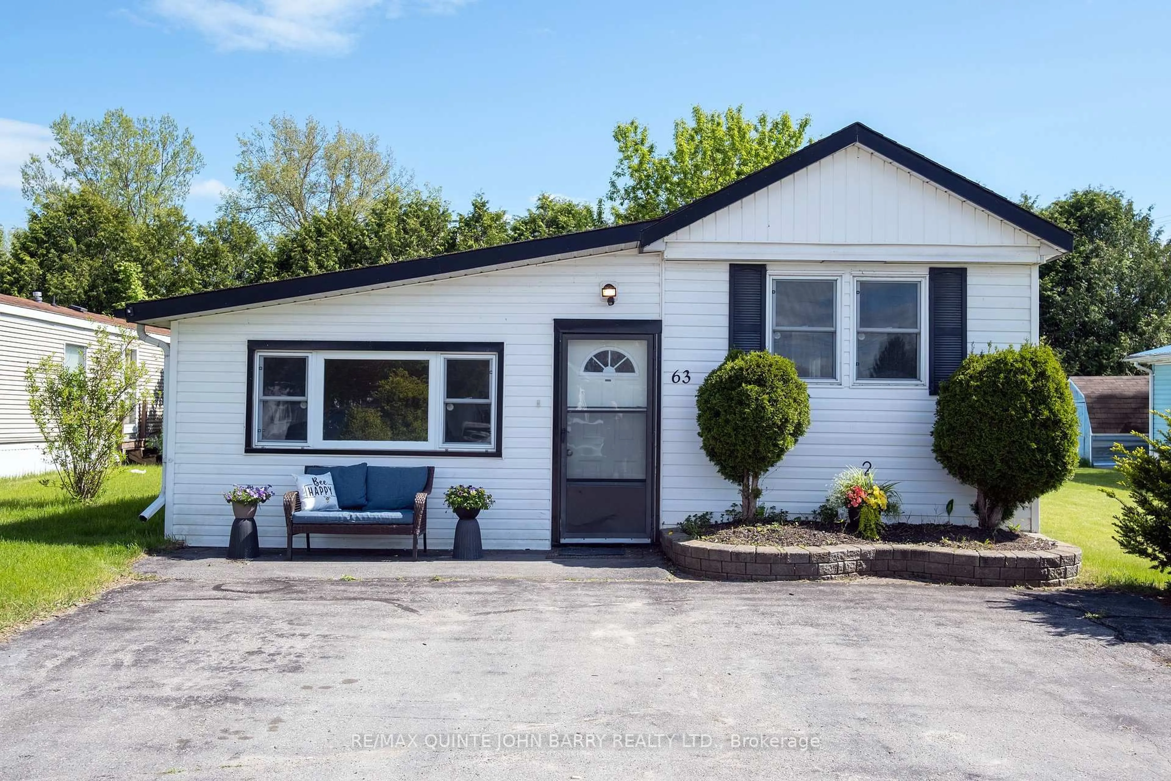 A pic from outside/outdoor area/front of a property/back of a property/a pic from drone, street for 63-529 Old Highway 2, Quinte West Ontario K8V 5P5