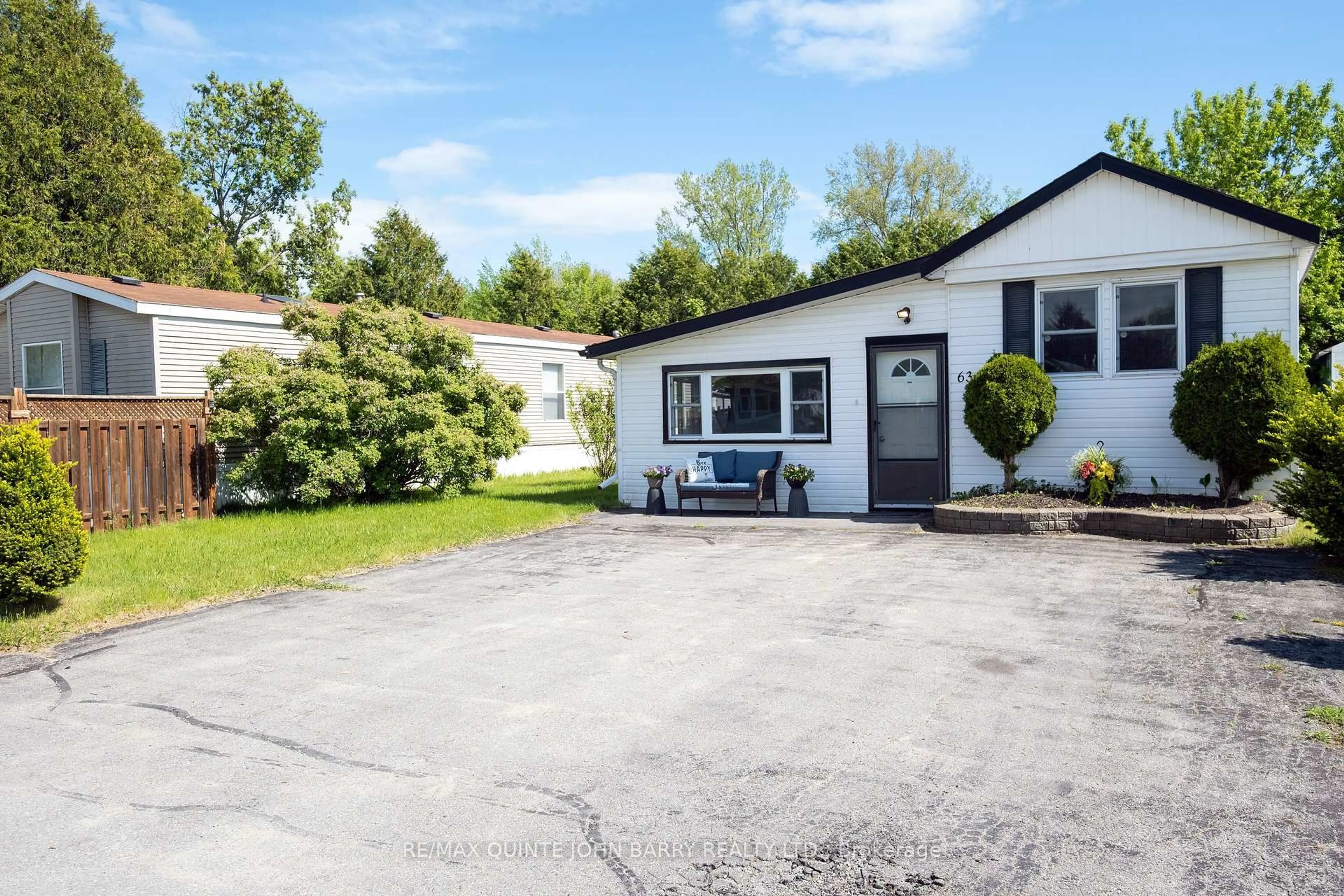 A pic from outside/outdoor area/front of a property/back of a property/a pic from drone, street for 63-529 Old Highway 2, Quinte West Ontario K8V 5P5
