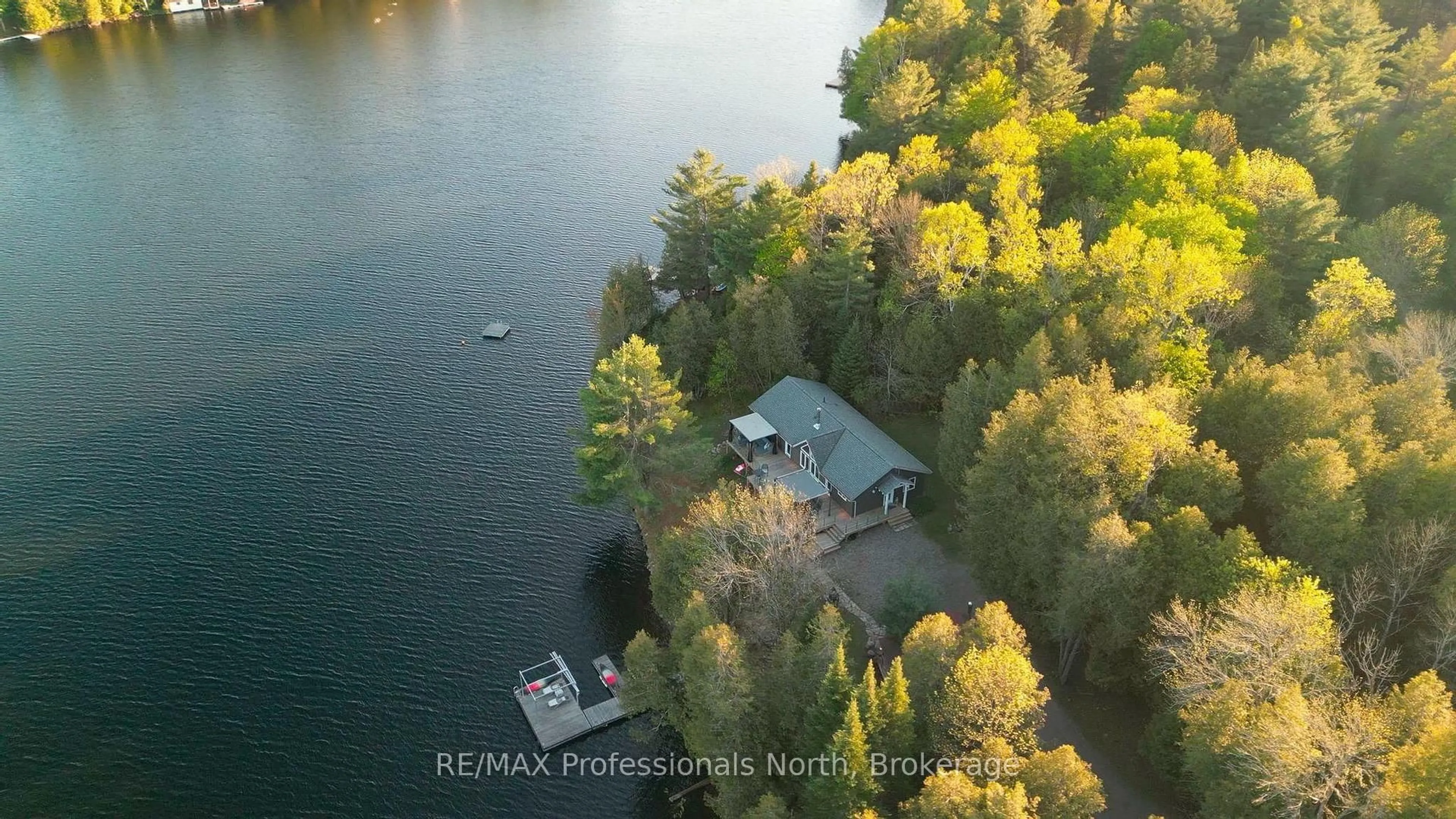 A pic from outside/outdoor area/front of a property/back of a property/a pic from drone, water/lake/river/ocean view for 1484 Bat Lake Rd, Minden Hills Ontario K0M 2K0