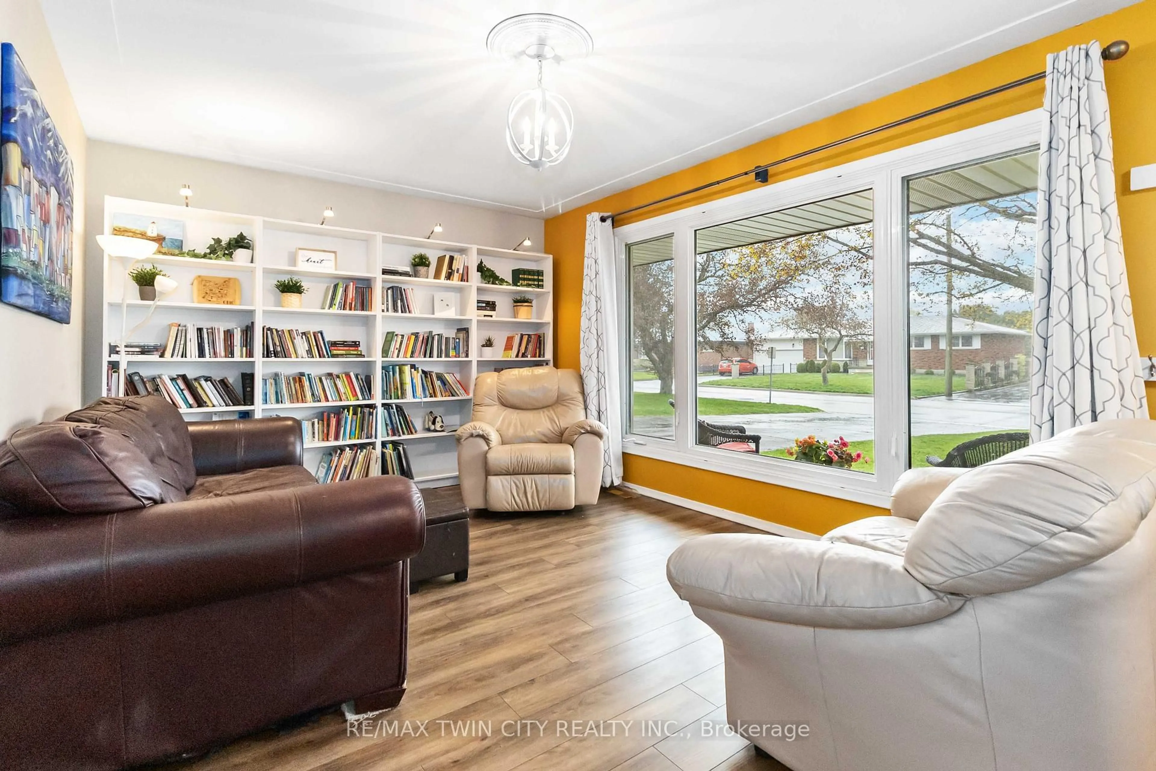Living room with furniture, wood/laminate floor for 83 Varadi Ave, Brantford Ontario N3R 3N4