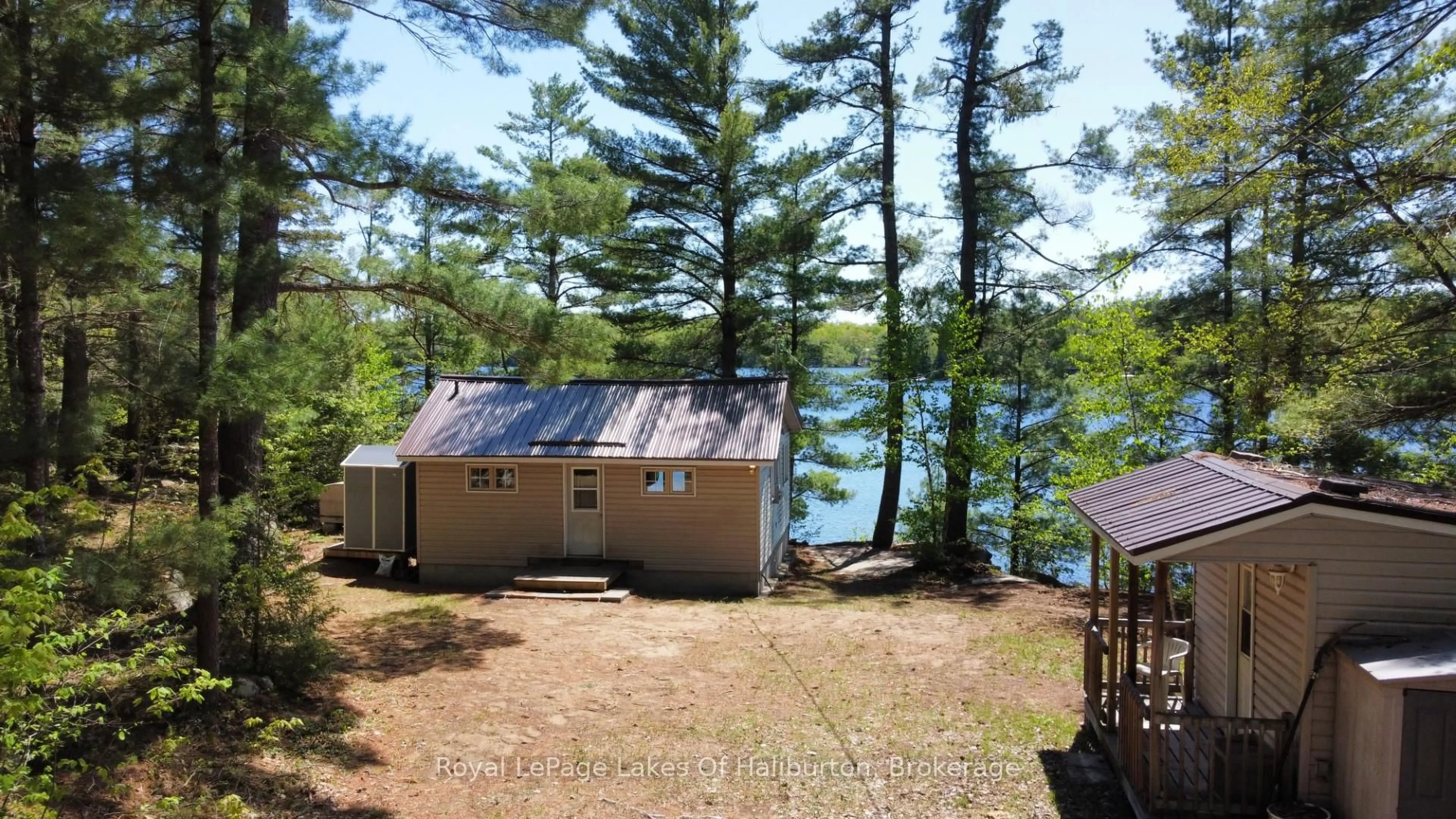 A pic from outside/outdoor area/front of a property/back of a property/a pic from drone, water/lake/river/ocean view for 1062 Dockside Dr, Minden Hills Ontario K0M 2K0