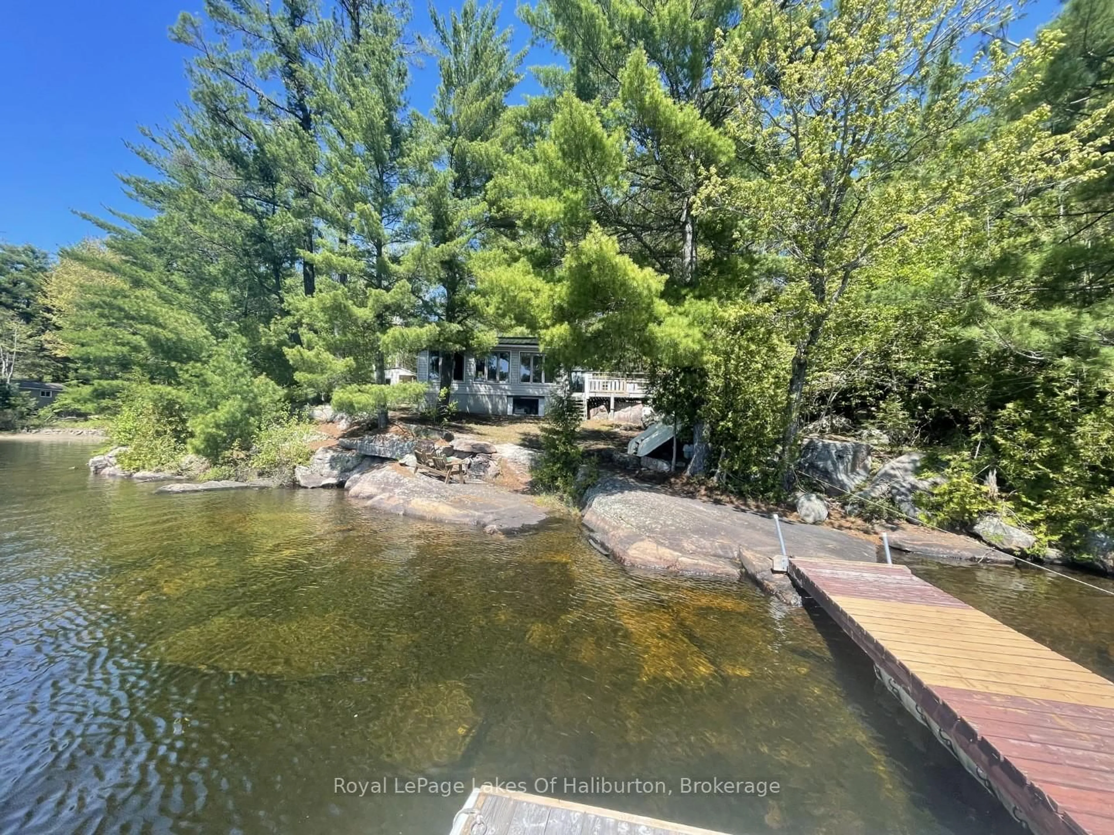 A pic from outside/outdoor area/front of a property/back of a property/a pic from drone, water/lake/river/ocean view for 1062 Dockside Dr, Minden Hills Ontario K0M 2K0