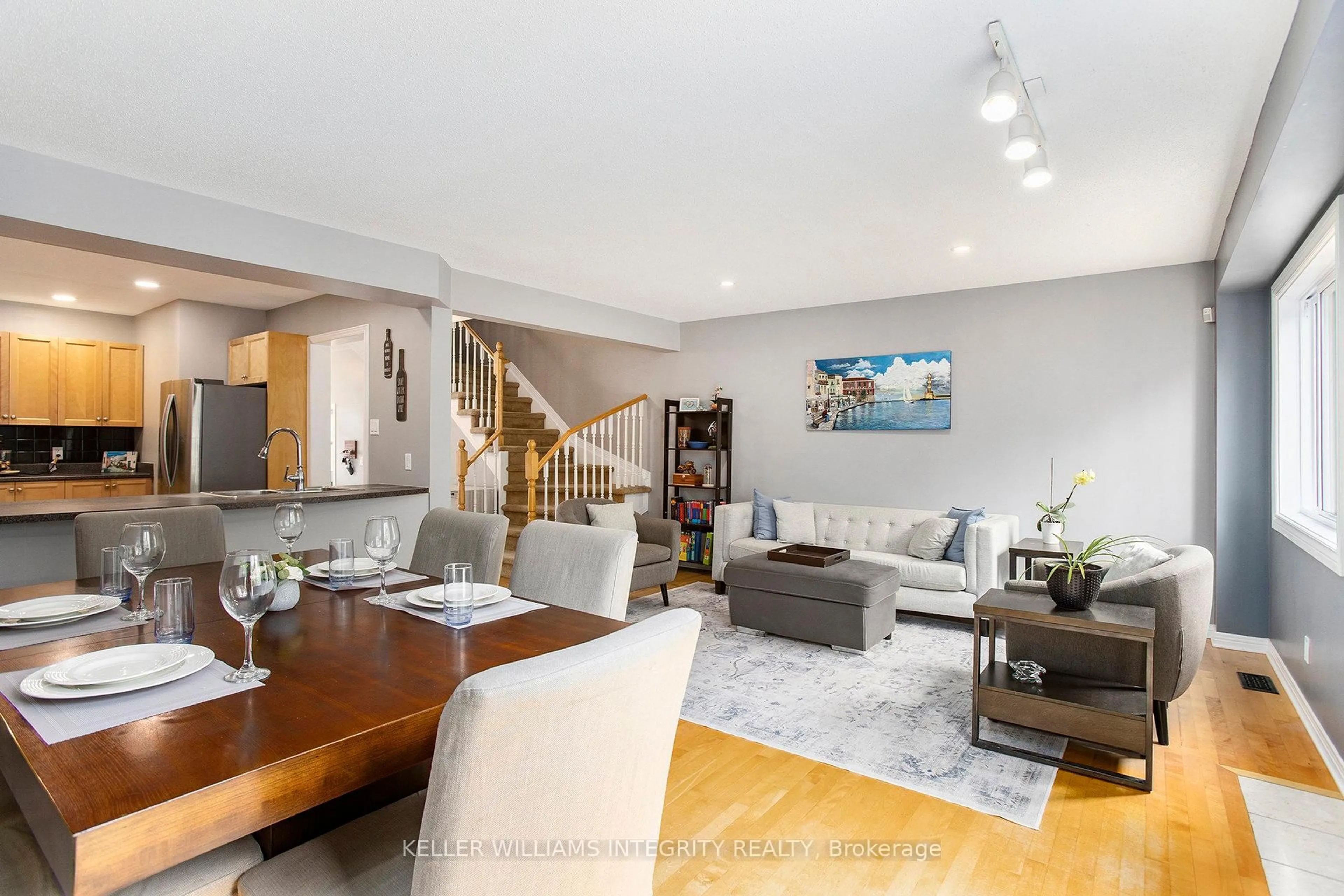 Living room with furniture, wood/laminate floor for 532 Wild Shore Cres, Ottawa Ontario K1V 1S9