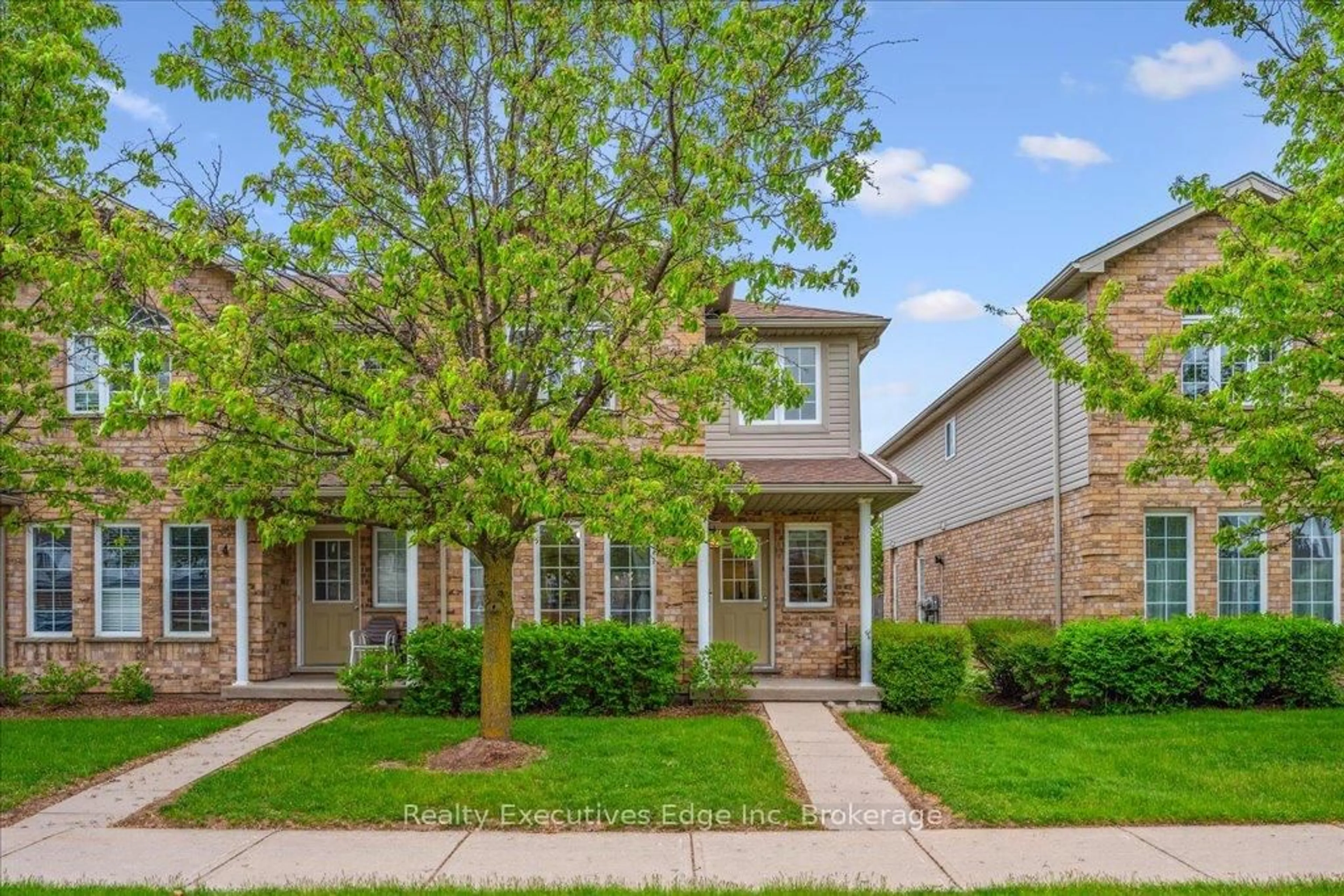 Home with brick exterior material, street for 210 Dawn Ave #Unit#5, Guelph Ontario N1G 5L5