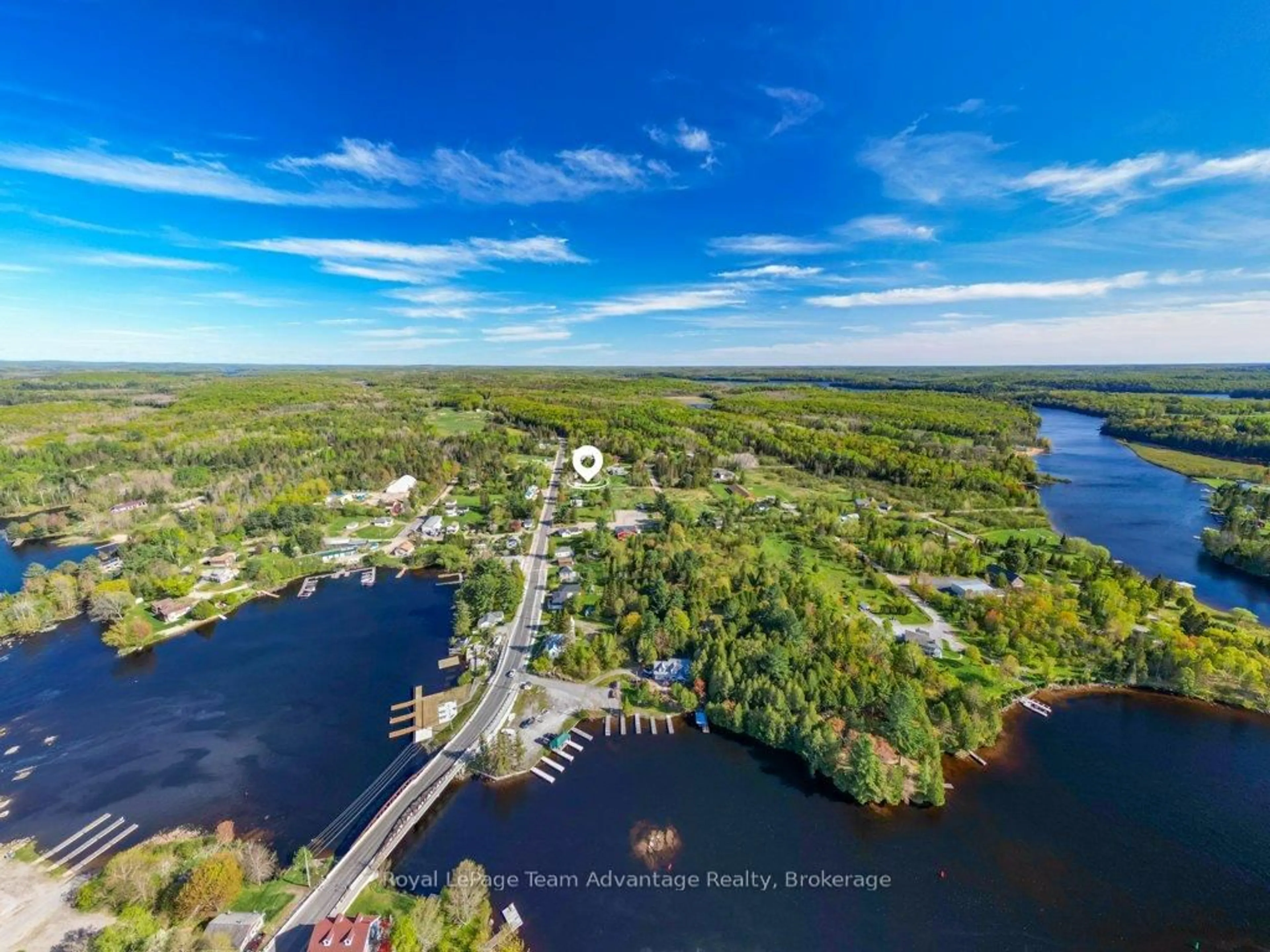 A pic from outside/outdoor area/front of a property/back of a property/a pic from drone, water/lake/river/ocean view for 56 South Sparks St, Magnetawan Ontario P0A 1P0