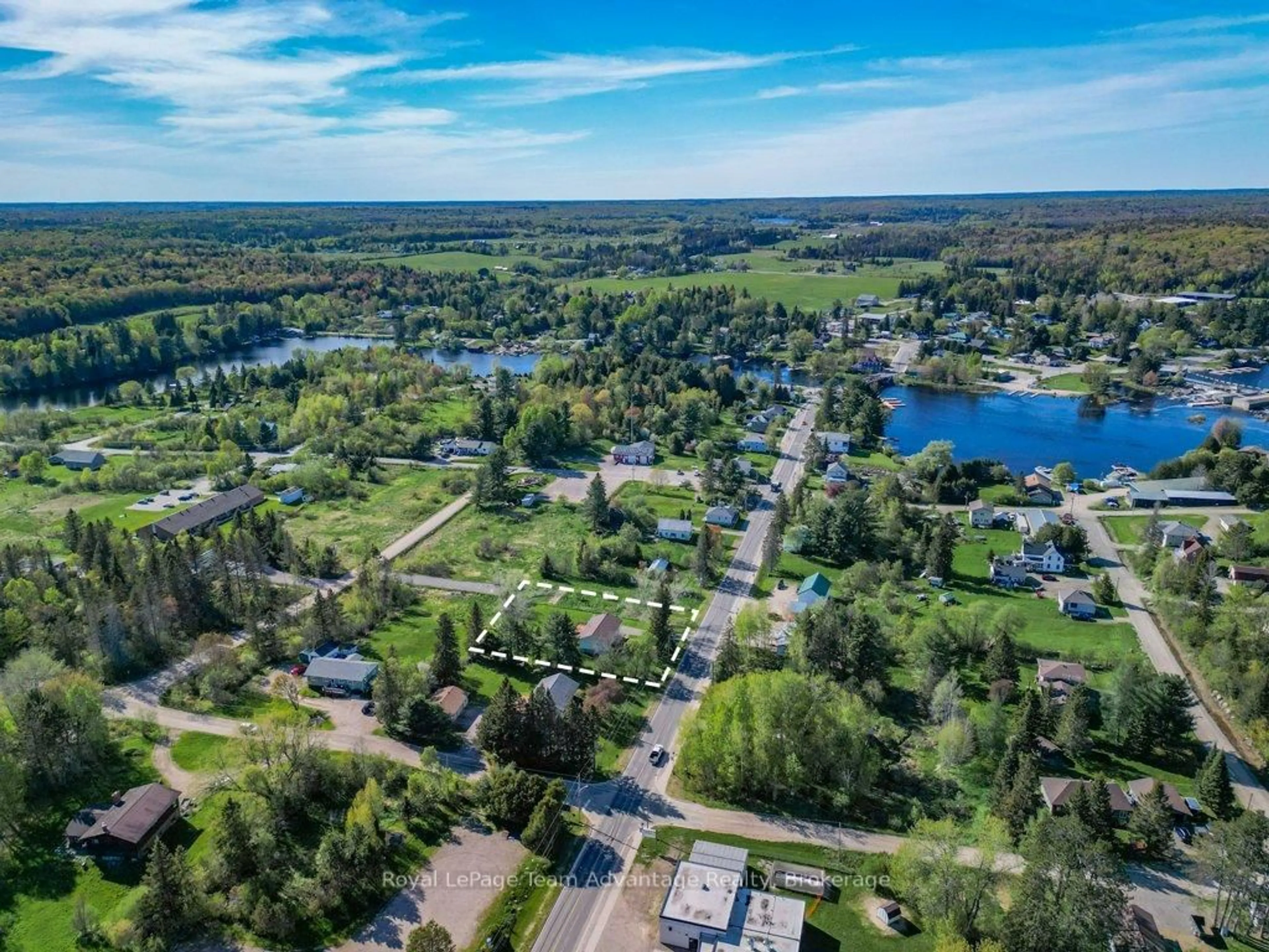 A pic from outside/outdoor area/front of a property/back of a property/a pic from drone, water/lake/river/ocean view for 56 South Sparks St, Magnetawan Ontario P0A 1P0