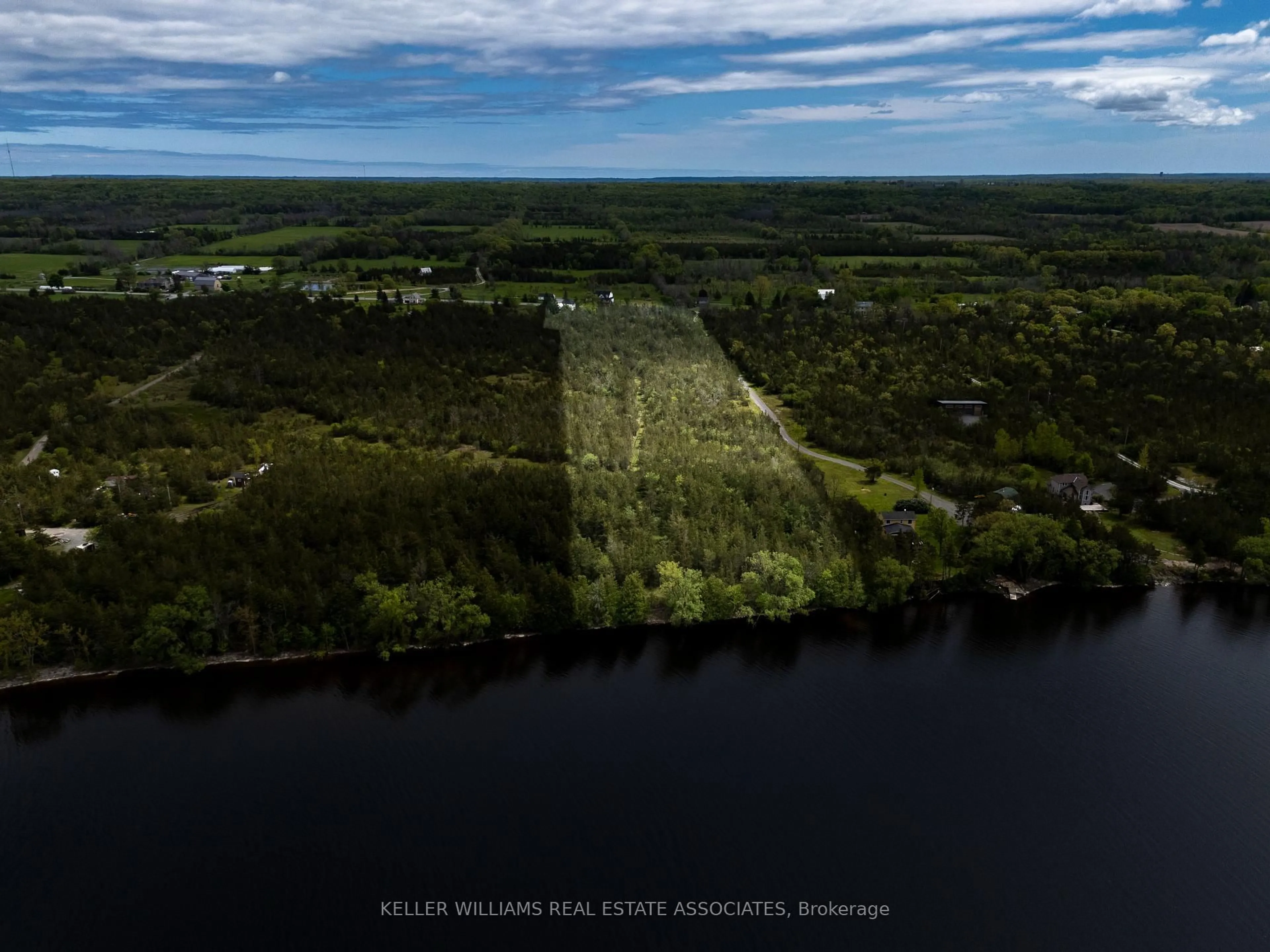 A pic from outside/outdoor area/front of a property/back of a property/a pic from drone, water/lake/river/ocean view for 2511 County Road 15 Rd, Prince Edward County Ontario N8M 2X6