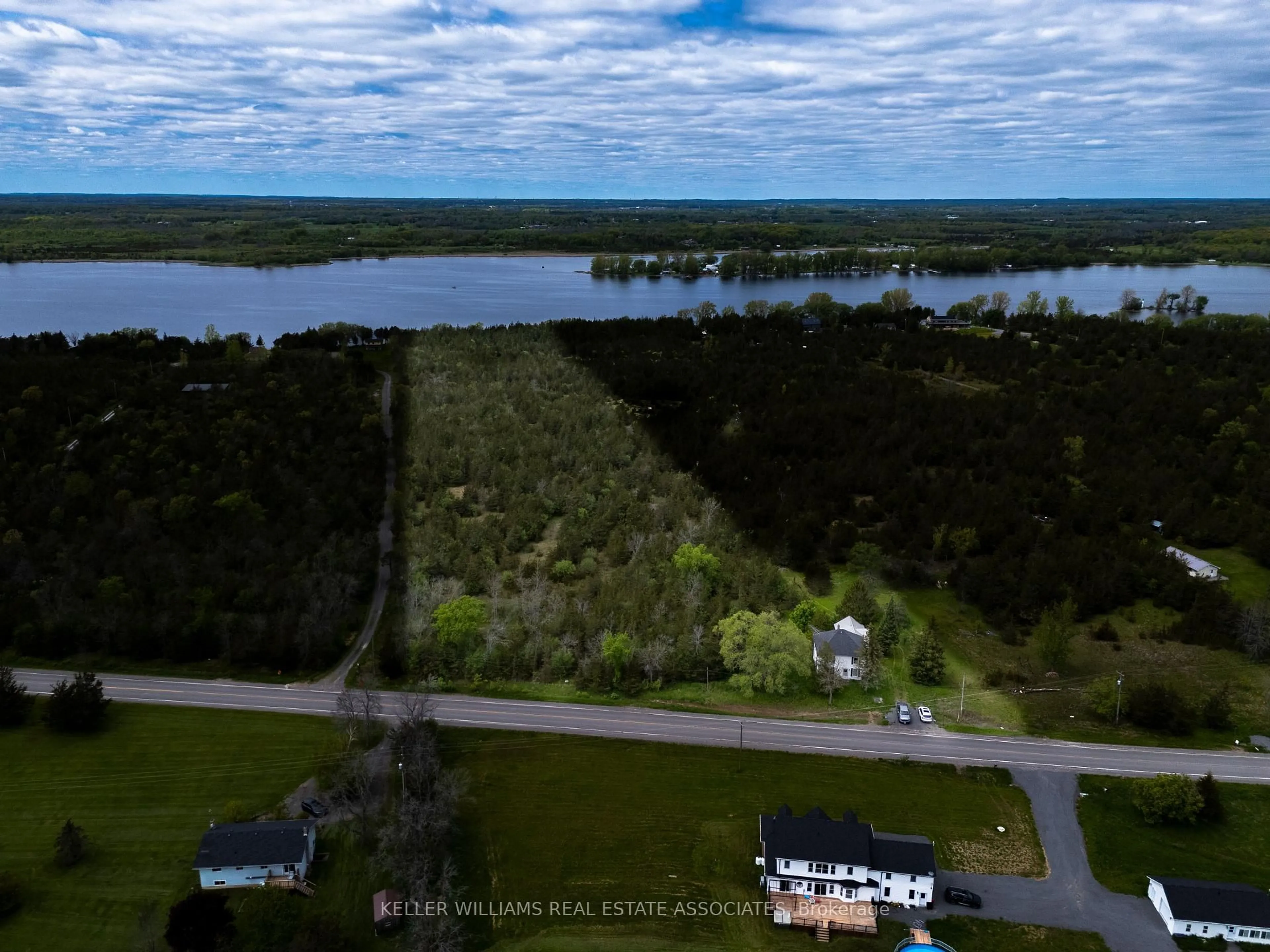 A pic from outside/outdoor area/front of a property/back of a property/a pic from drone, water/lake/river/ocean view for 2511 County Road 15 Rd, Prince Edward County Ontario N8M 2X6