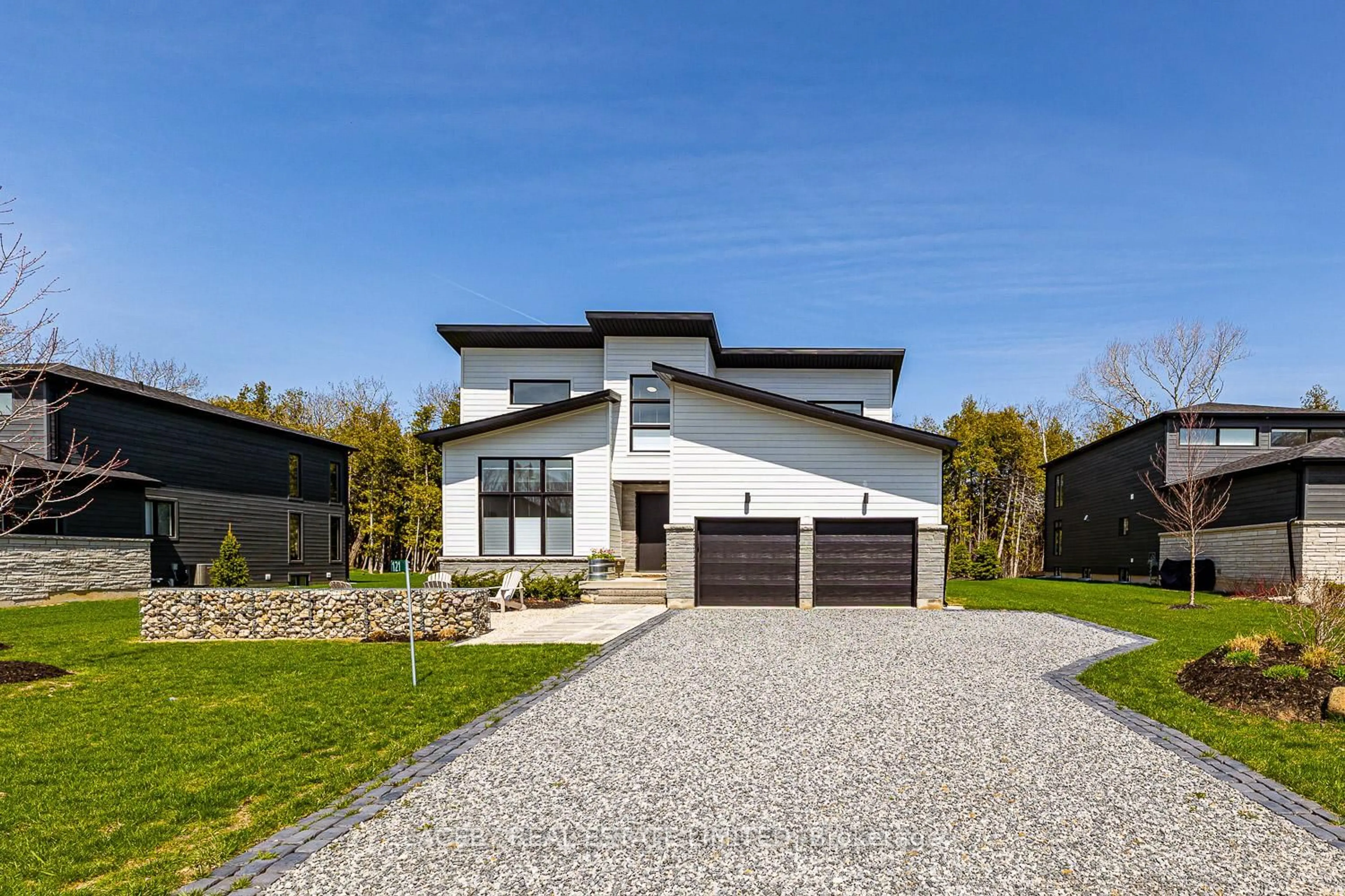Home with brick exterior material, street for 121 Tekiah Rd, Blue Mountains Ontario N0H 1J0