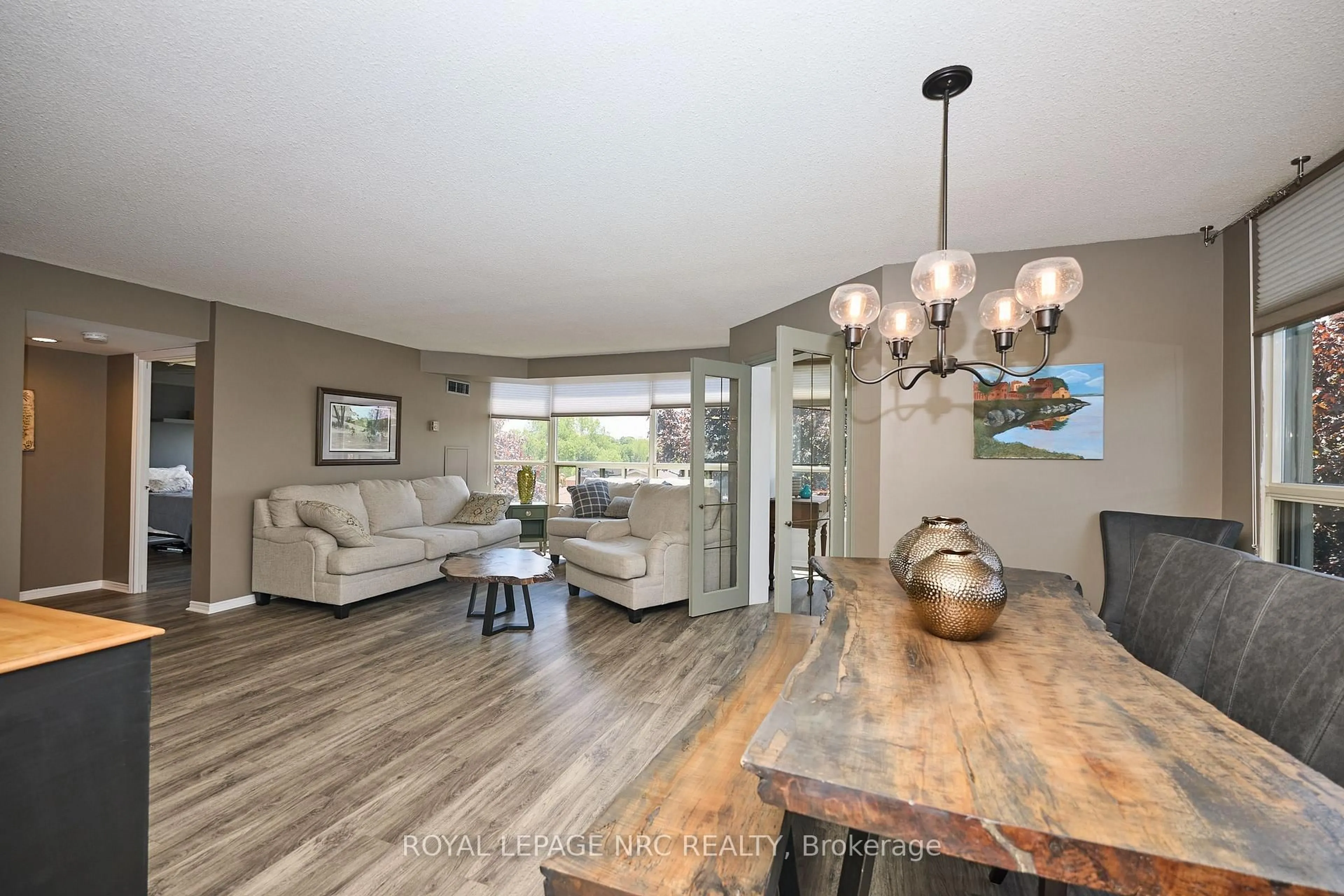 Open concept kitchen, wood/laminate floor for 5100 DORCHESTER Rd #403, Niagara Falls Ontario L2E 7H4