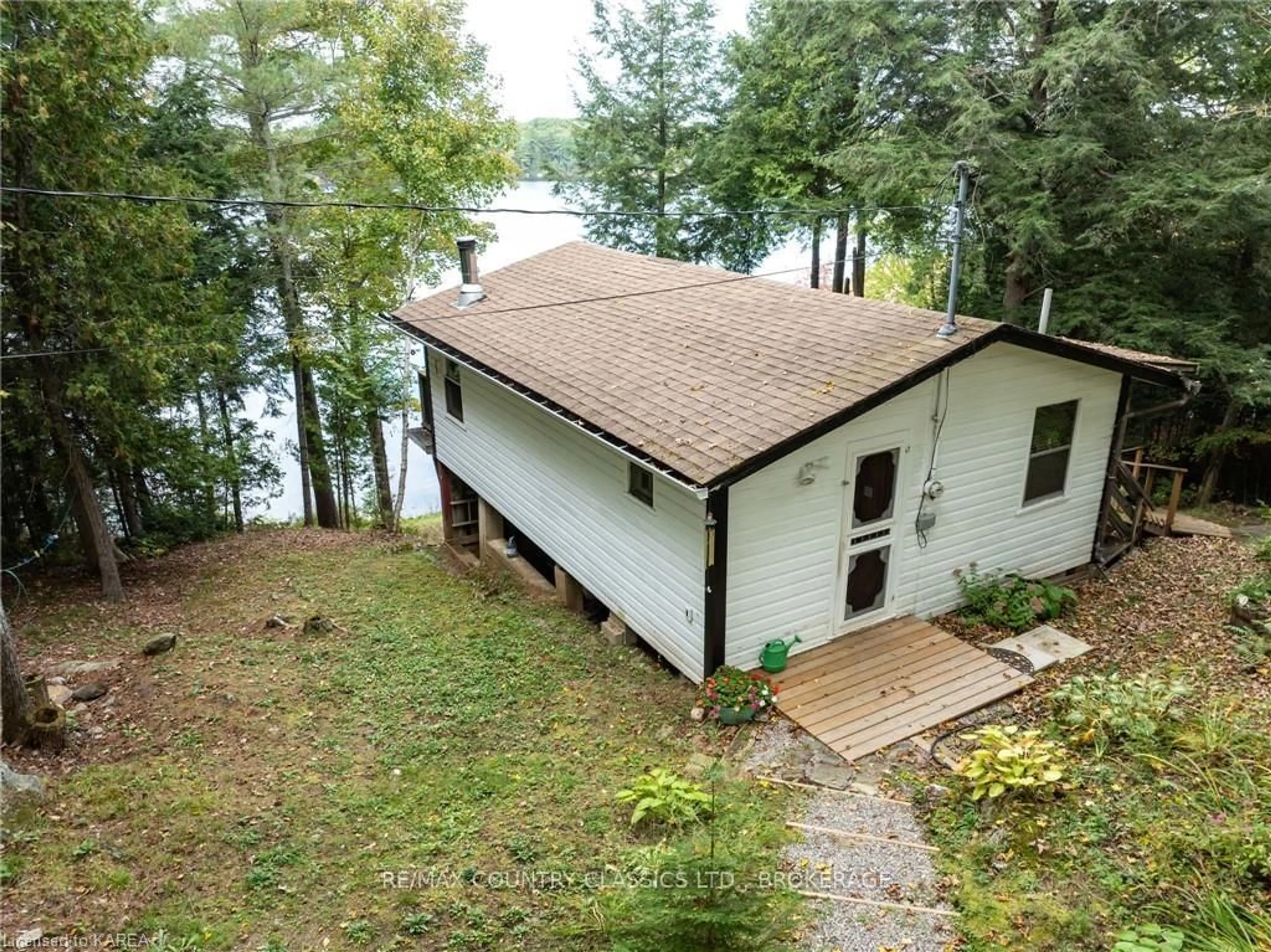 A pic from outside/outdoor area/front of a property/back of a property/a pic from drone, water/lake/river/ocean view for 1054 EARL BAY Lane, Arden Ontario K0H 1B0