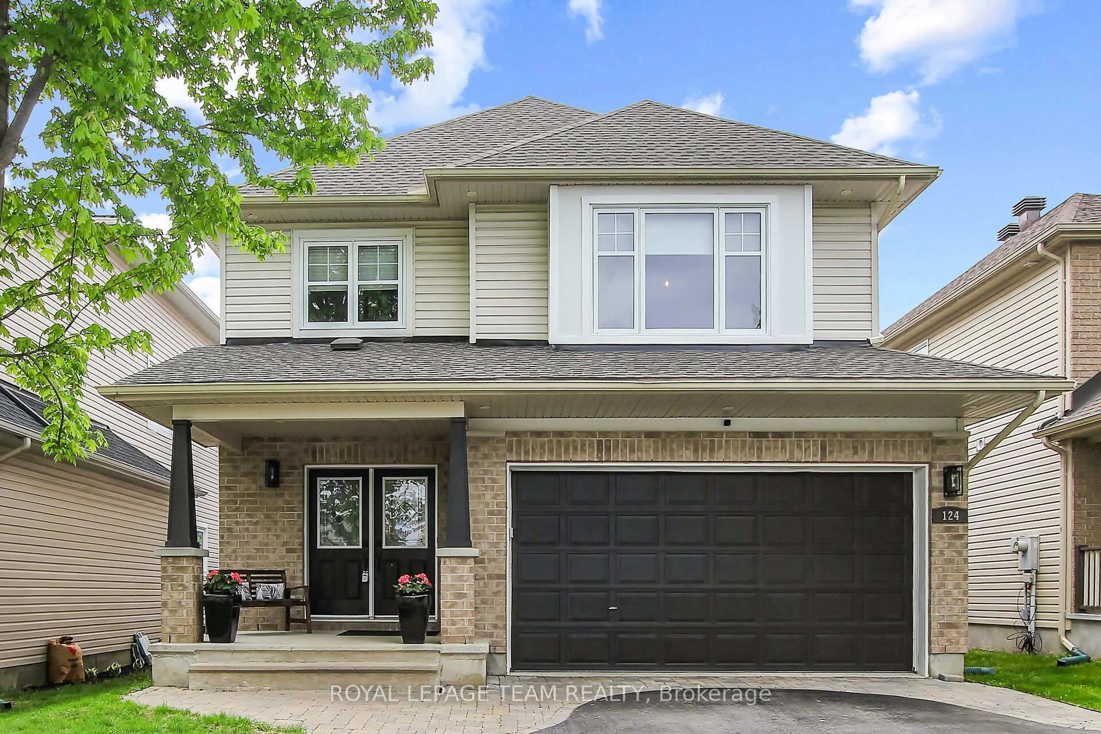 Home with brick exterior material, street for 124 Versilia Dr, Ottawa Ontario K2G 7E2