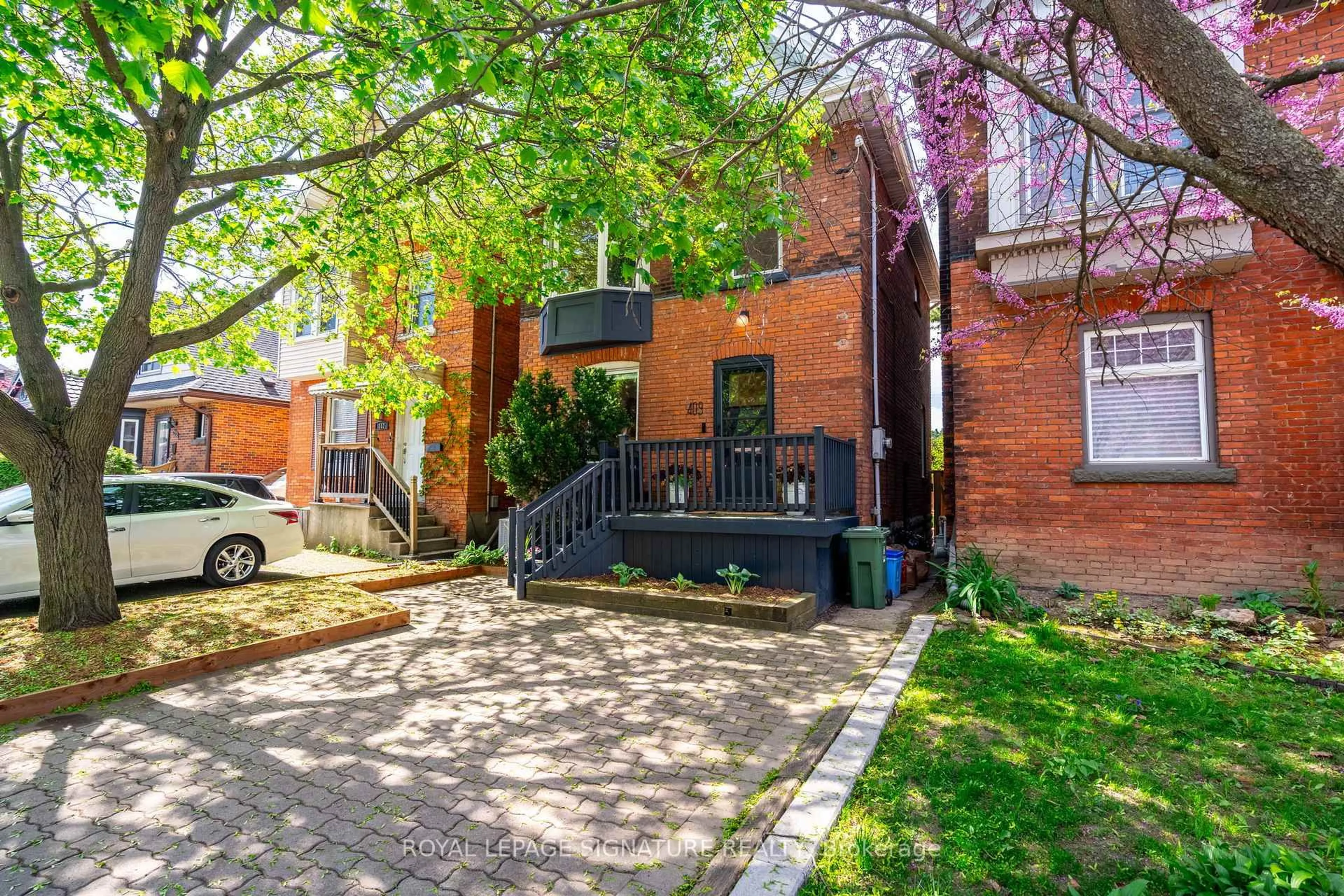 Home with brick exterior material, street for 409 Herkimer St, Hamilton Ontario L8P 2J4
