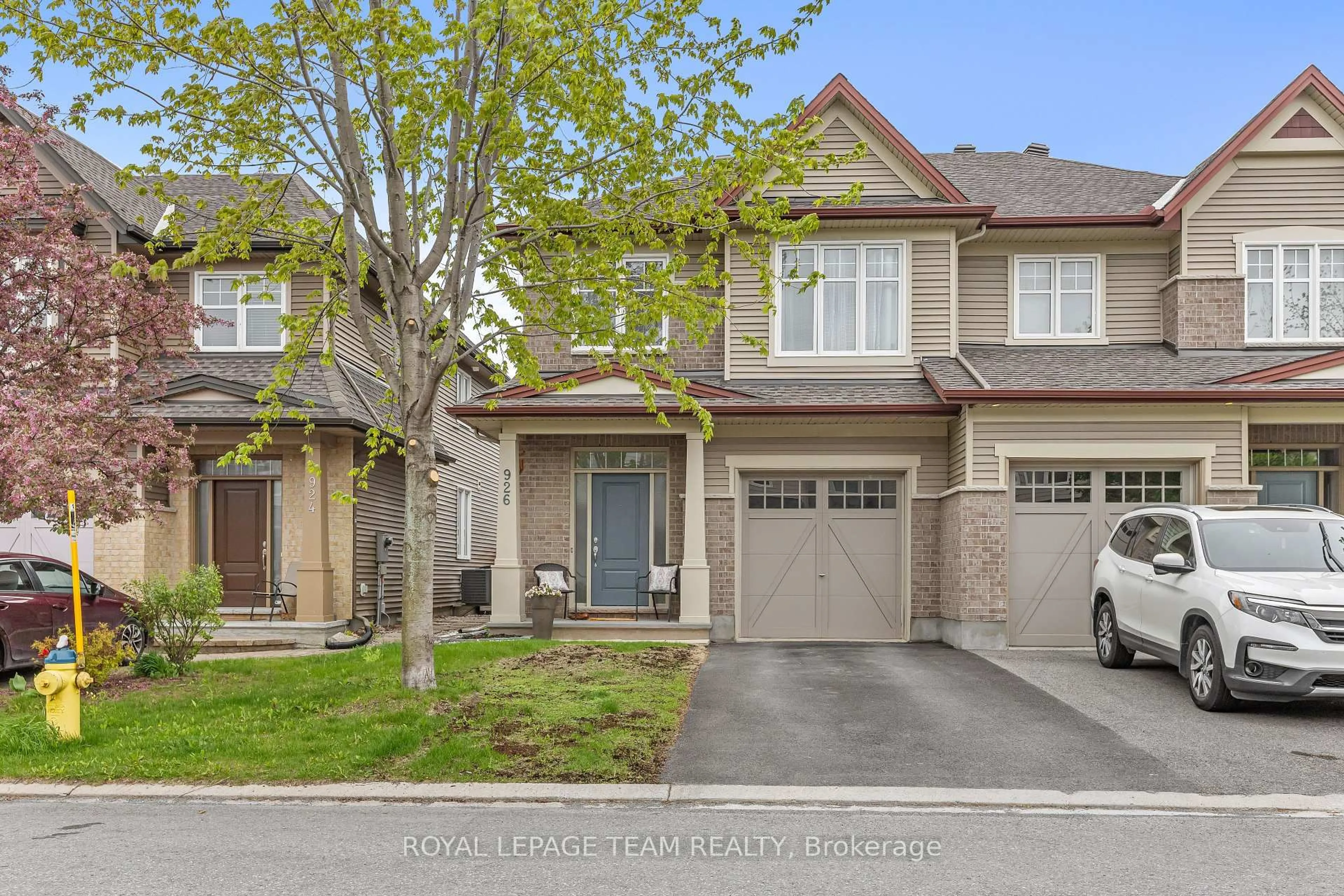 Home with brick exterior material, street for 926 Bunchberry Way, Ottawa Ontario K1T 3T8