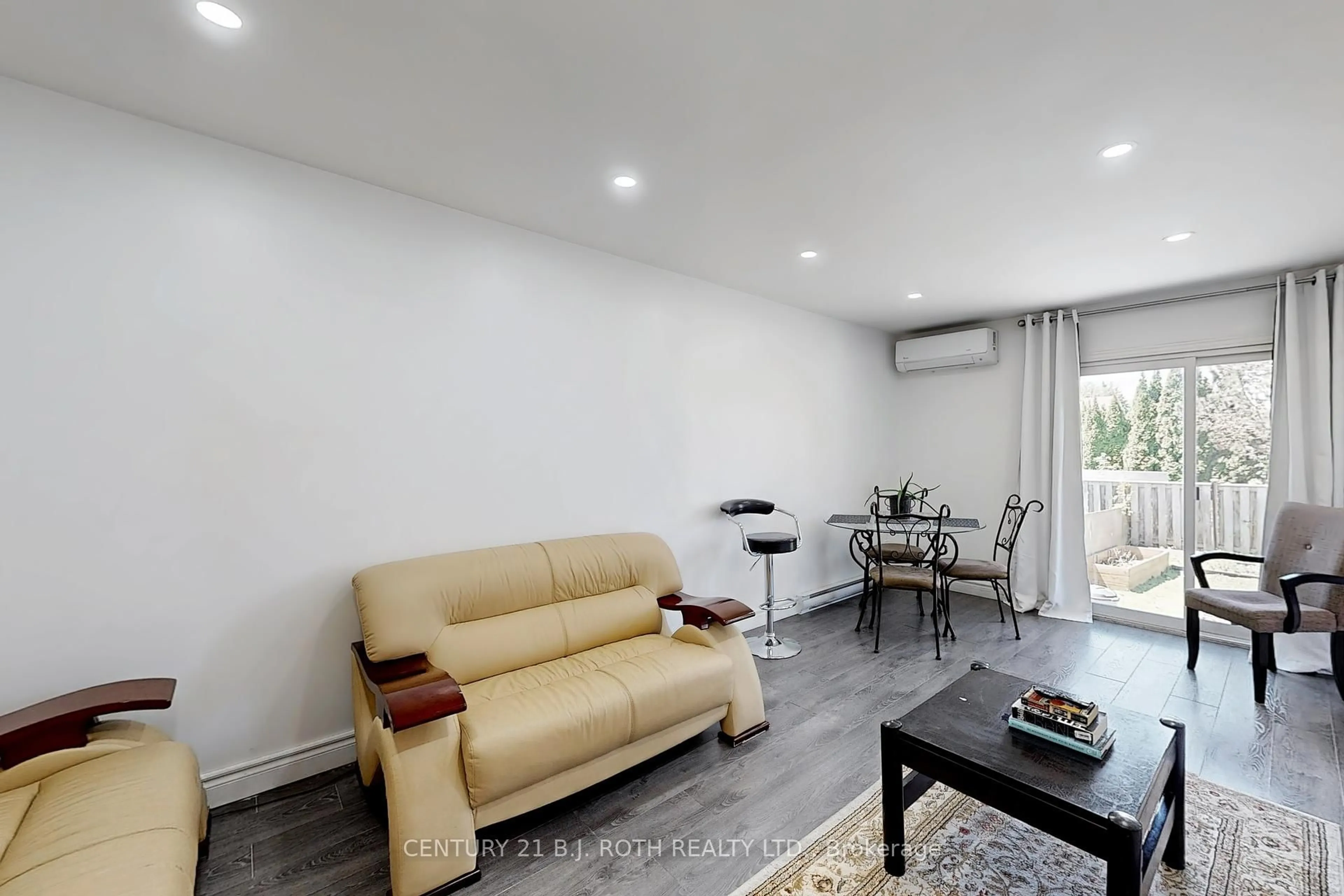 Living room with furniture, wood/laminate floor for 113 Albert St, Kawartha Lakes Ontario K9V 6G1
