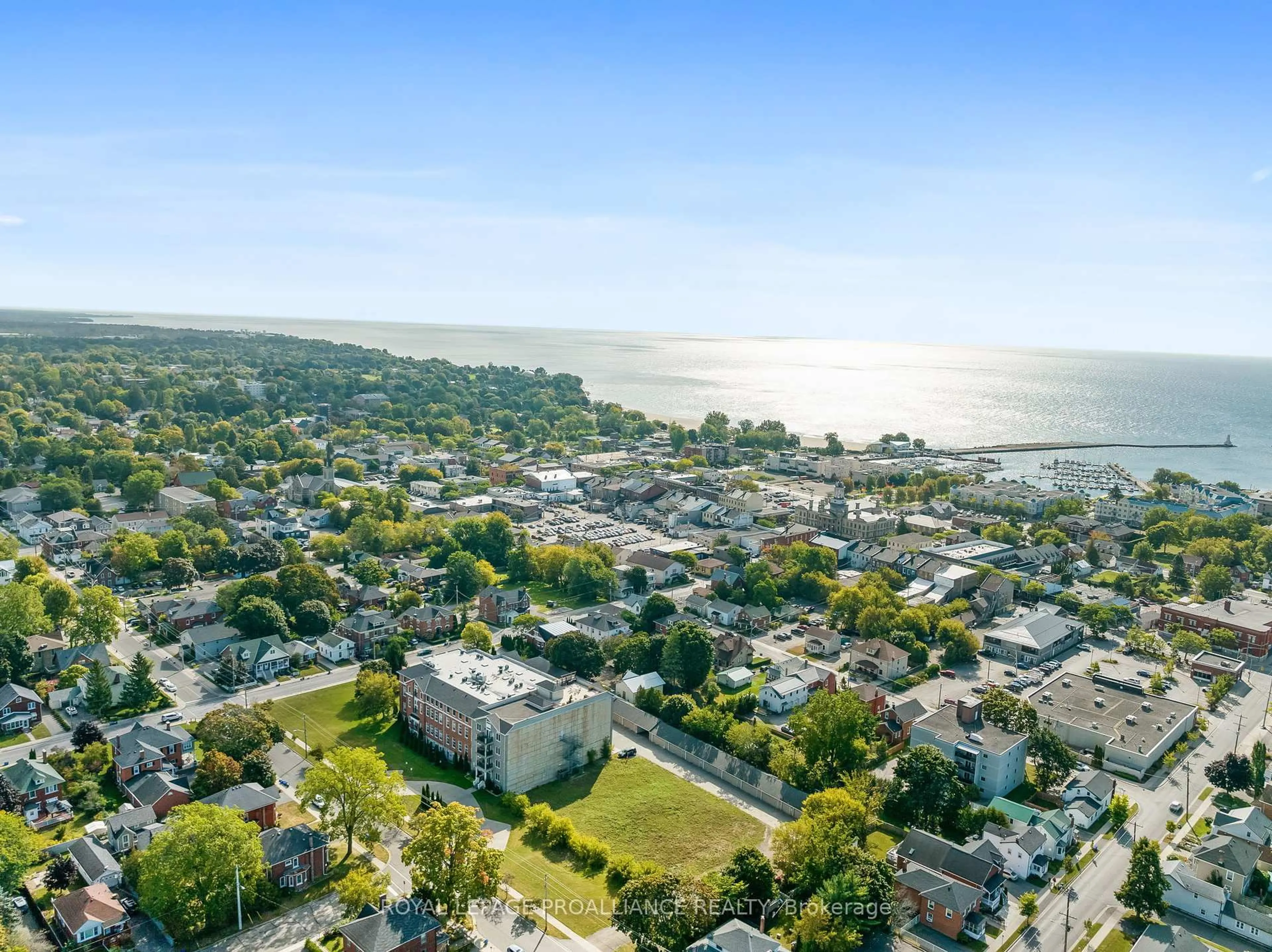 A pic from outside/outdoor area/front of a property/back of a property/a pic from drone, water/lake/river/ocean view for 323 George St #206, Cobourg Ontario K9A 3L9