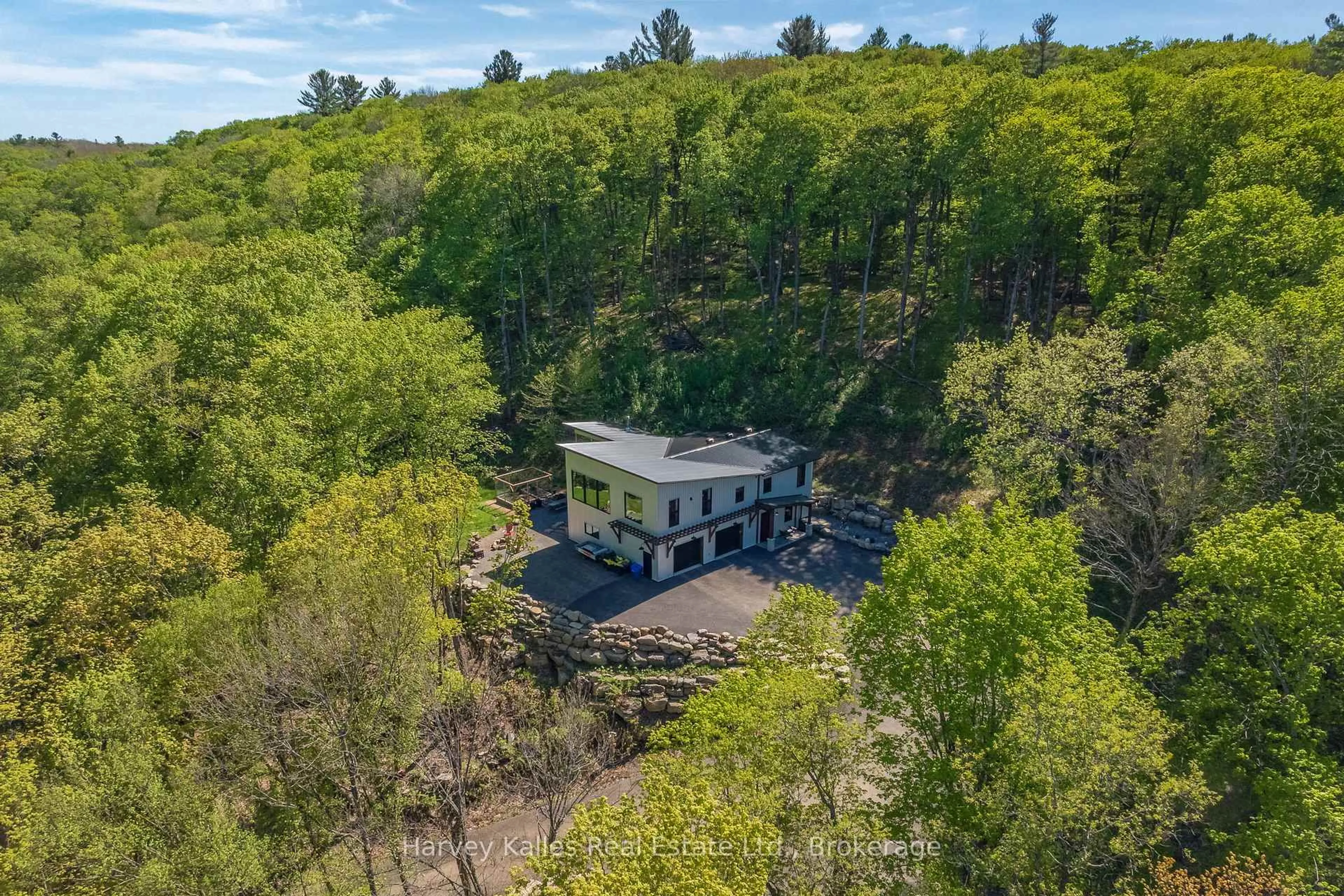 A pic from outside/outdoor area/front of a property/back of a property/a pic from drone, forest/trees view for 25 Natures Way, Huntsville Ontario P1H 0B4