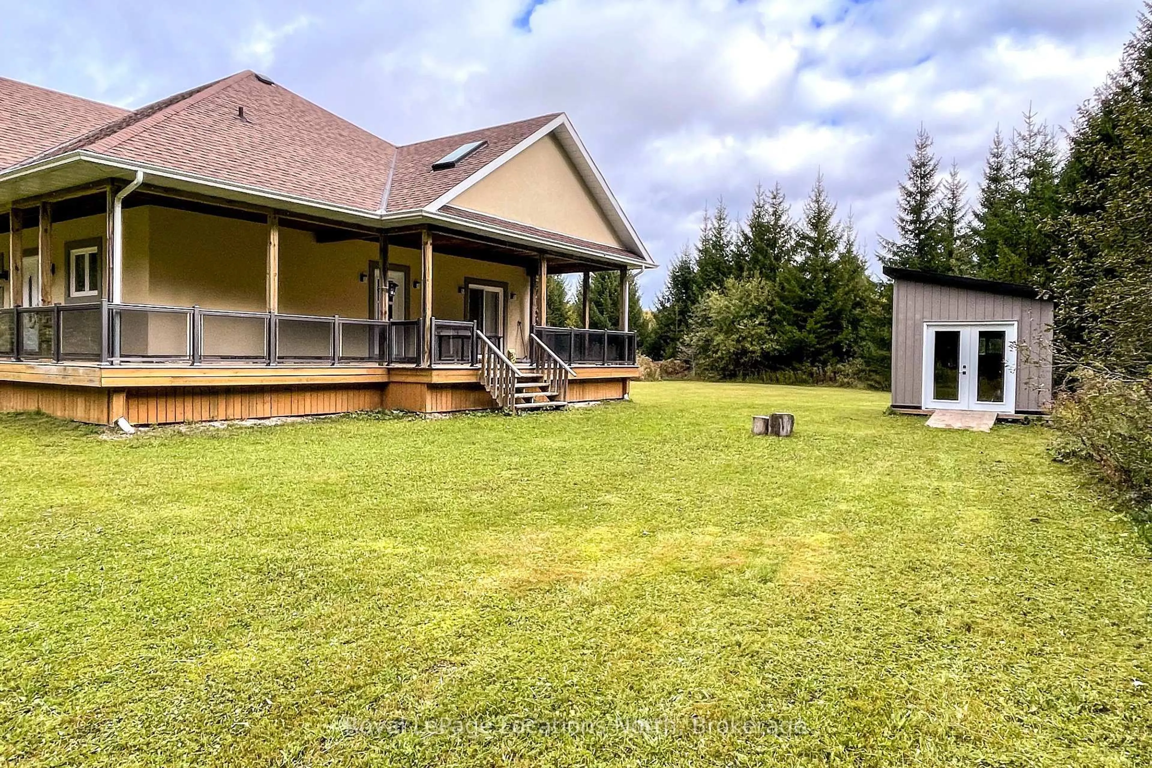 A pic from outside/outdoor area/front of a property/back of a property/a pic from drone, unknown for 595863 4th Line, Blue Mountains Ontario N0H 2E0