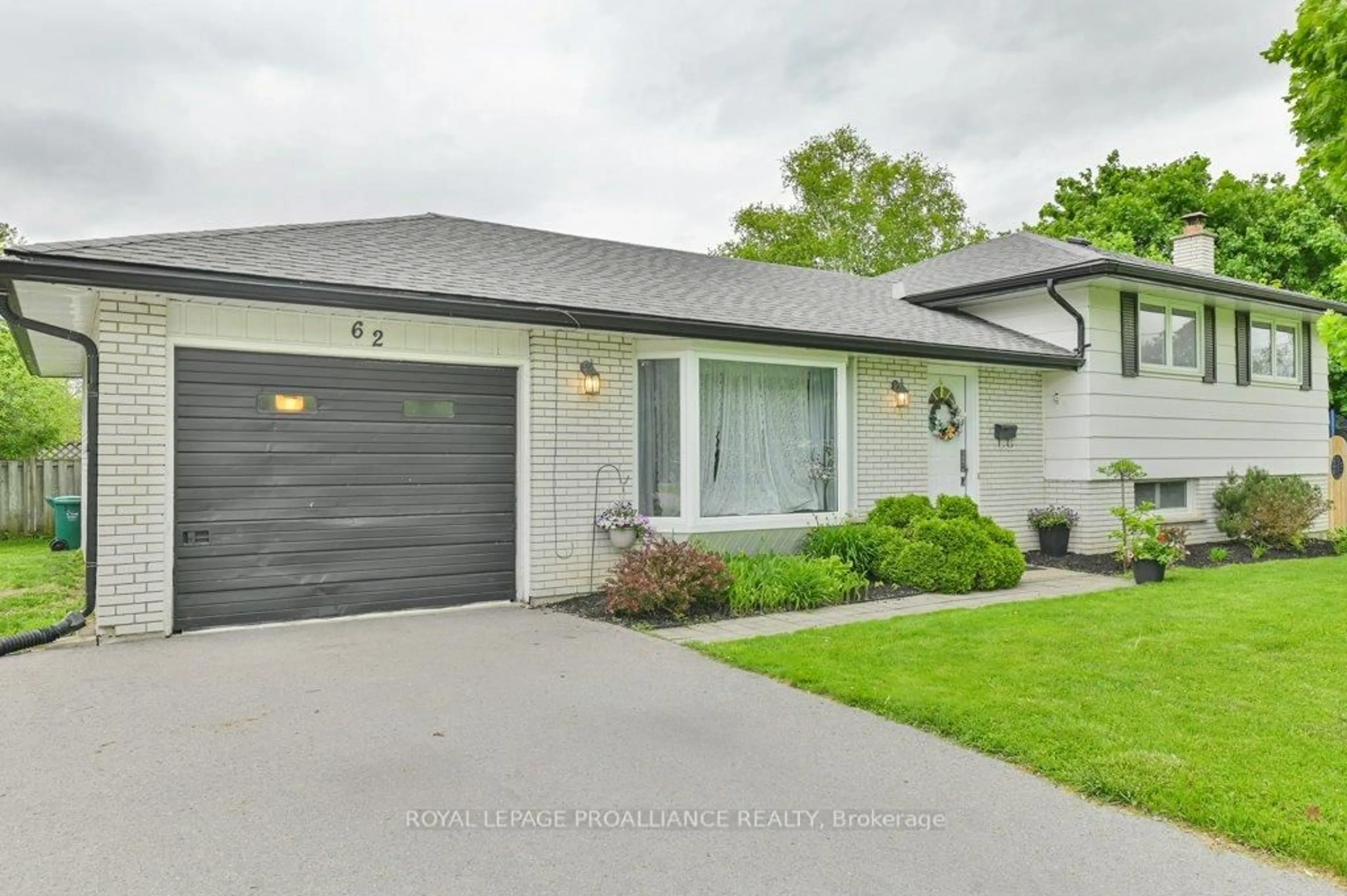 Home with vinyl exterior material, street for 62 Village Dr, Belleville Ontario K8P 4L5
