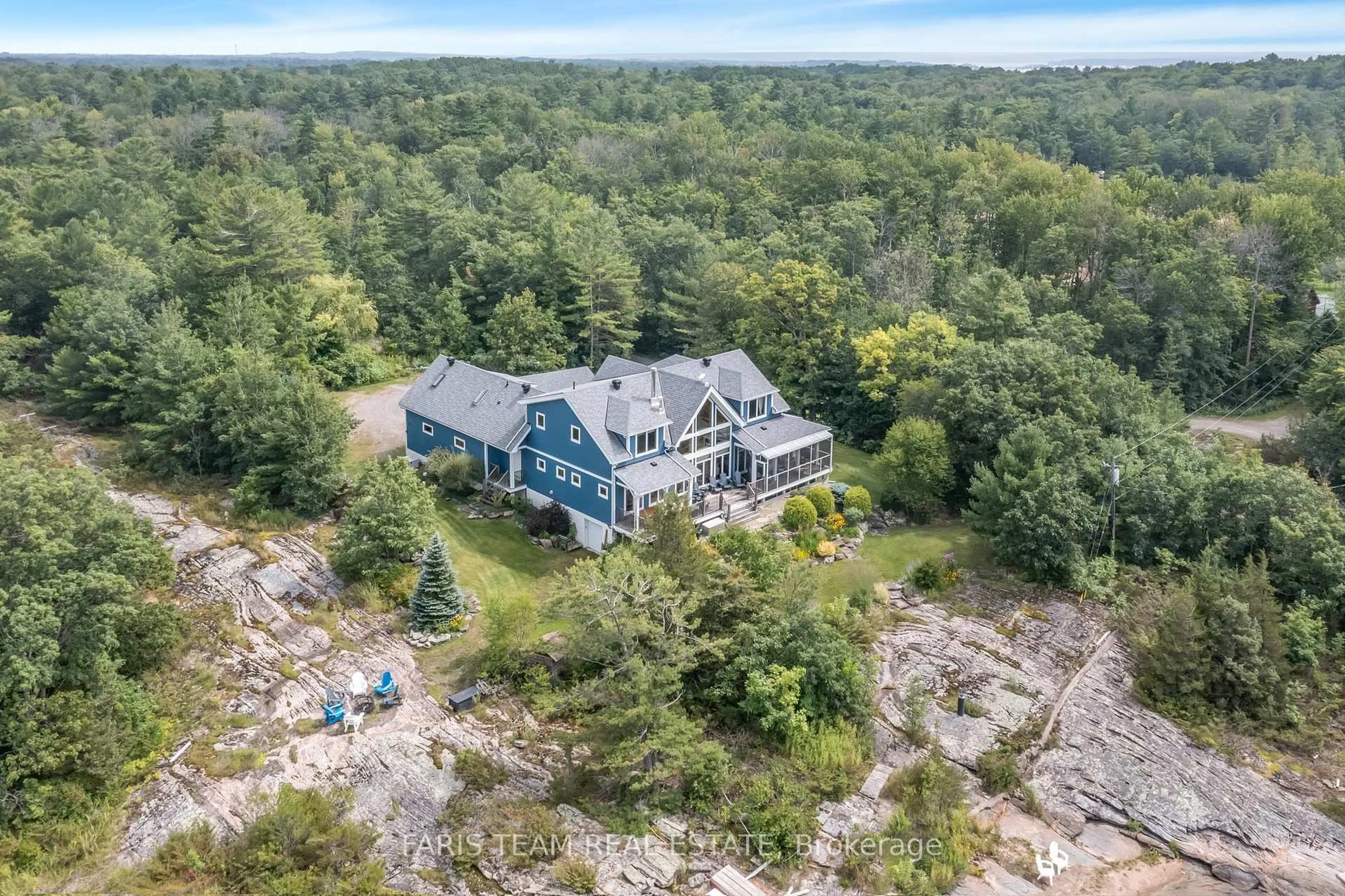 A pic from outside/outdoor area/front of a property/back of a property/a pic from drone, water/lake/river/ocean view for 70 Kamenni Bay Rd, Georgian Bay Ontario L0K 1S0