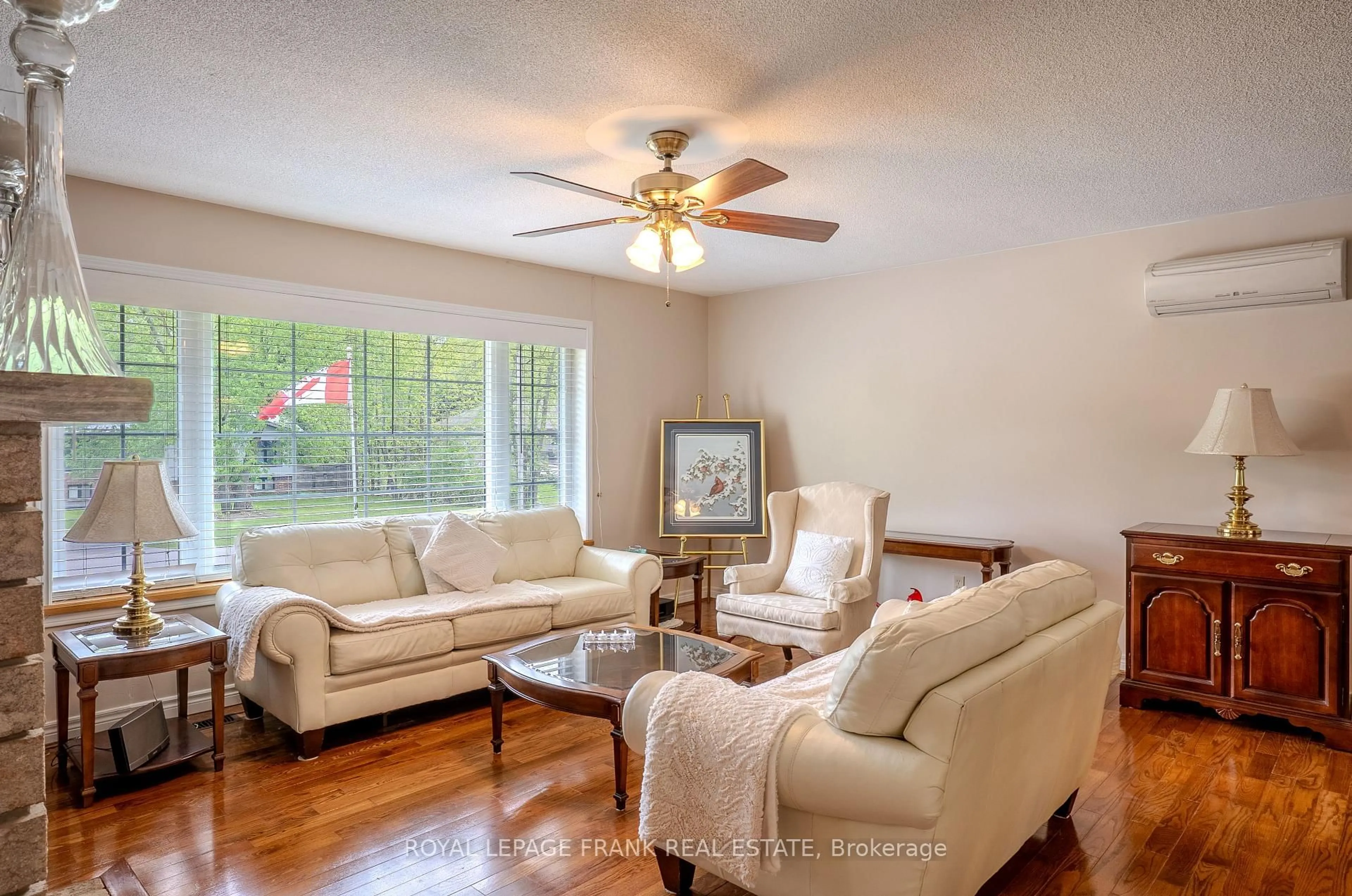Living room with furniture, wood/laminate floor for 97 Pirates Glen Dr, Trent Lakes Ontario K0M 1A0