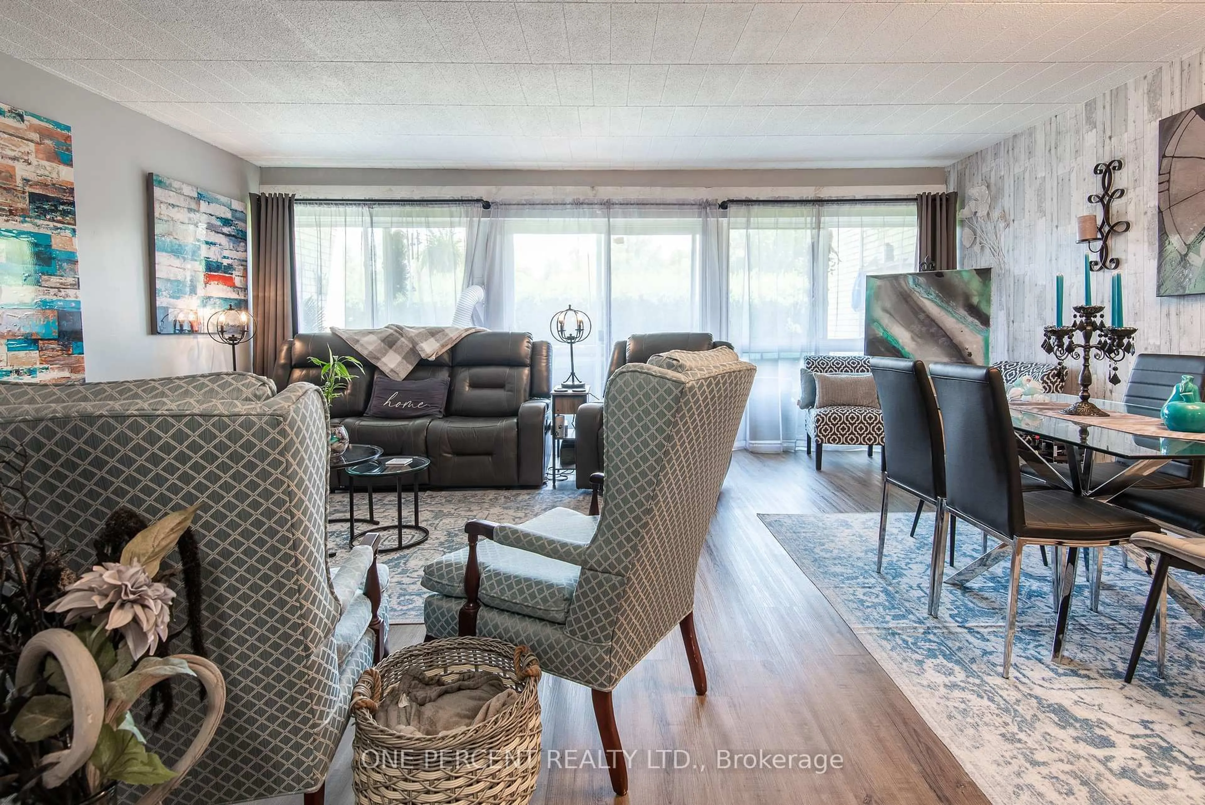 Living room with furniture, wood/laminate floor for 105 Conroy Cres #103, Guelph Ontario N1G 2V5