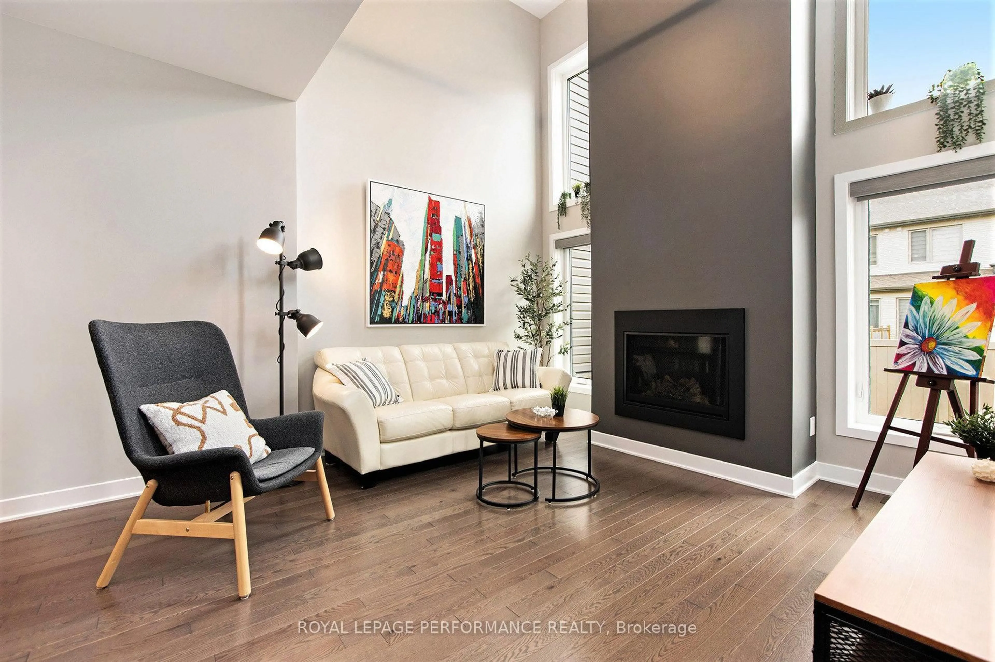 Living room with furniture, wood/laminate floor for 586 Triangle St, Ottawa Ontario K2V 0M1