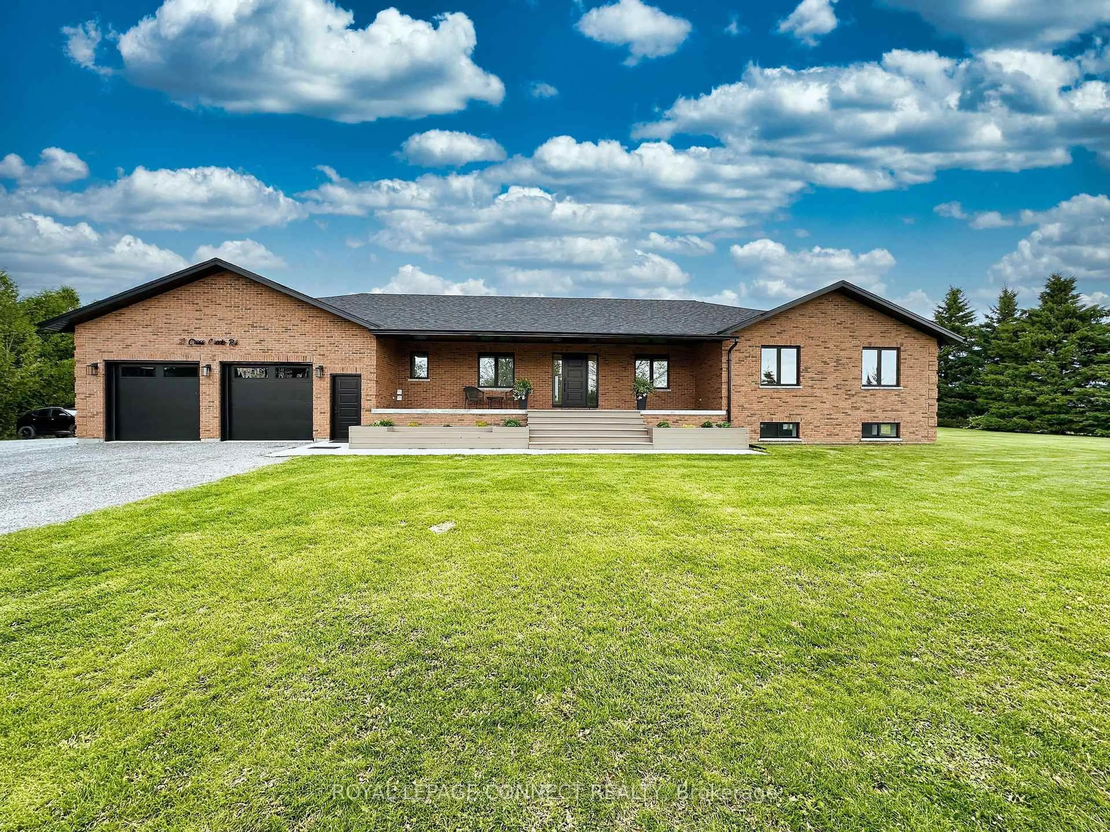 Home with brick exterior material, unknown for 11 Cross Creek Rd, Kawartha Lakes Ontario K0M 2C0