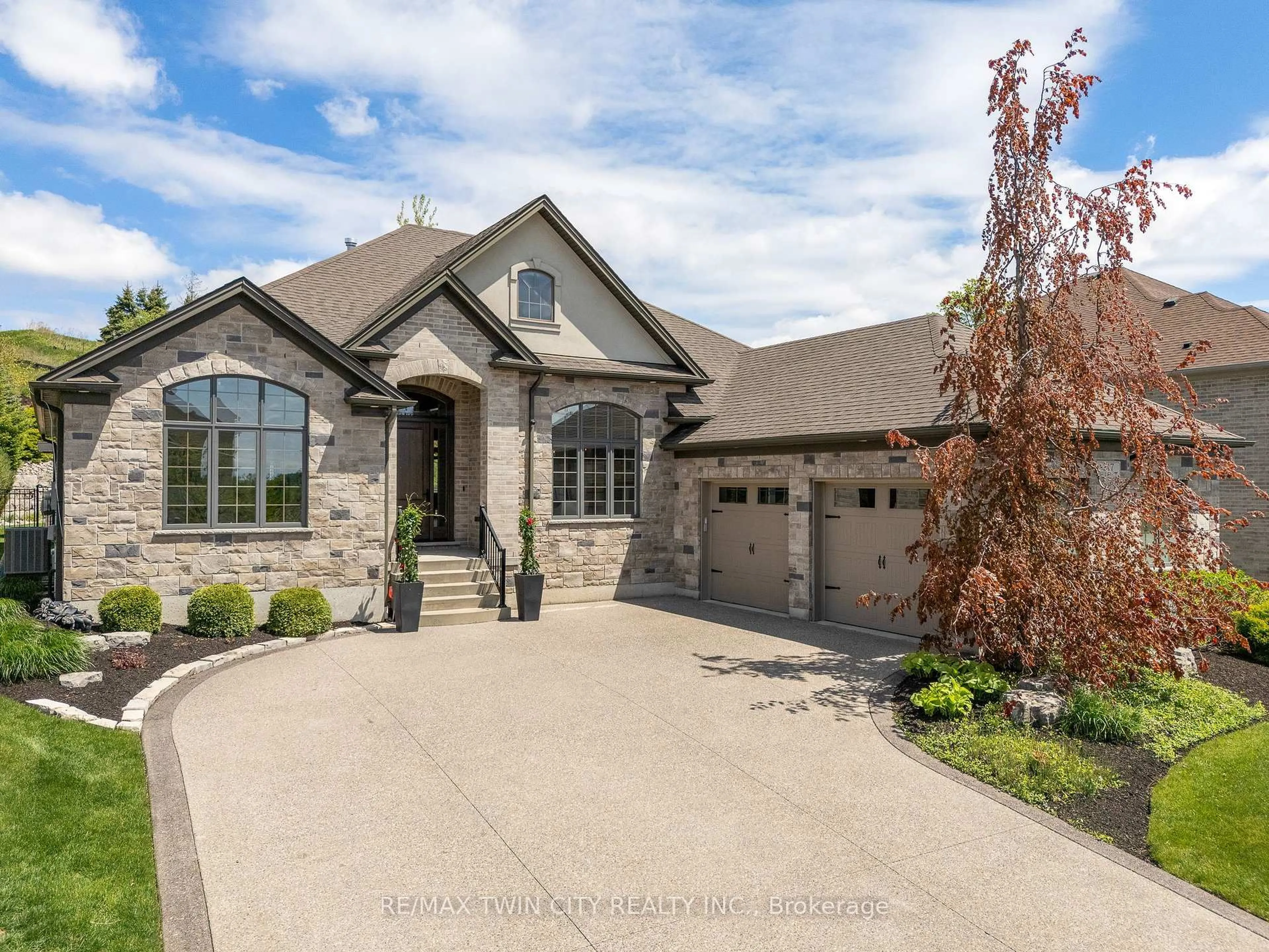 Home with brick exterior material, street for 217 River Birch St, Kitchener Ontario N2C 2V3