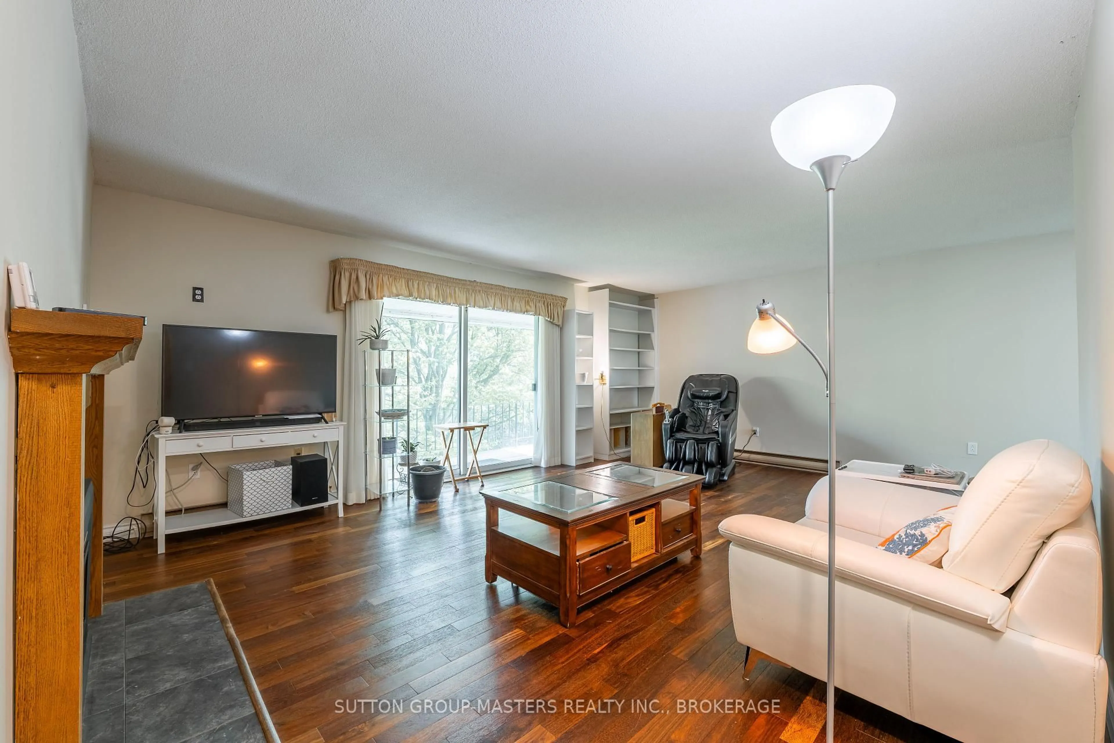 Living room with furniture, wood/laminate floor for 2851 Rutledge Rd, Sydenham Ontario K0H 2T0