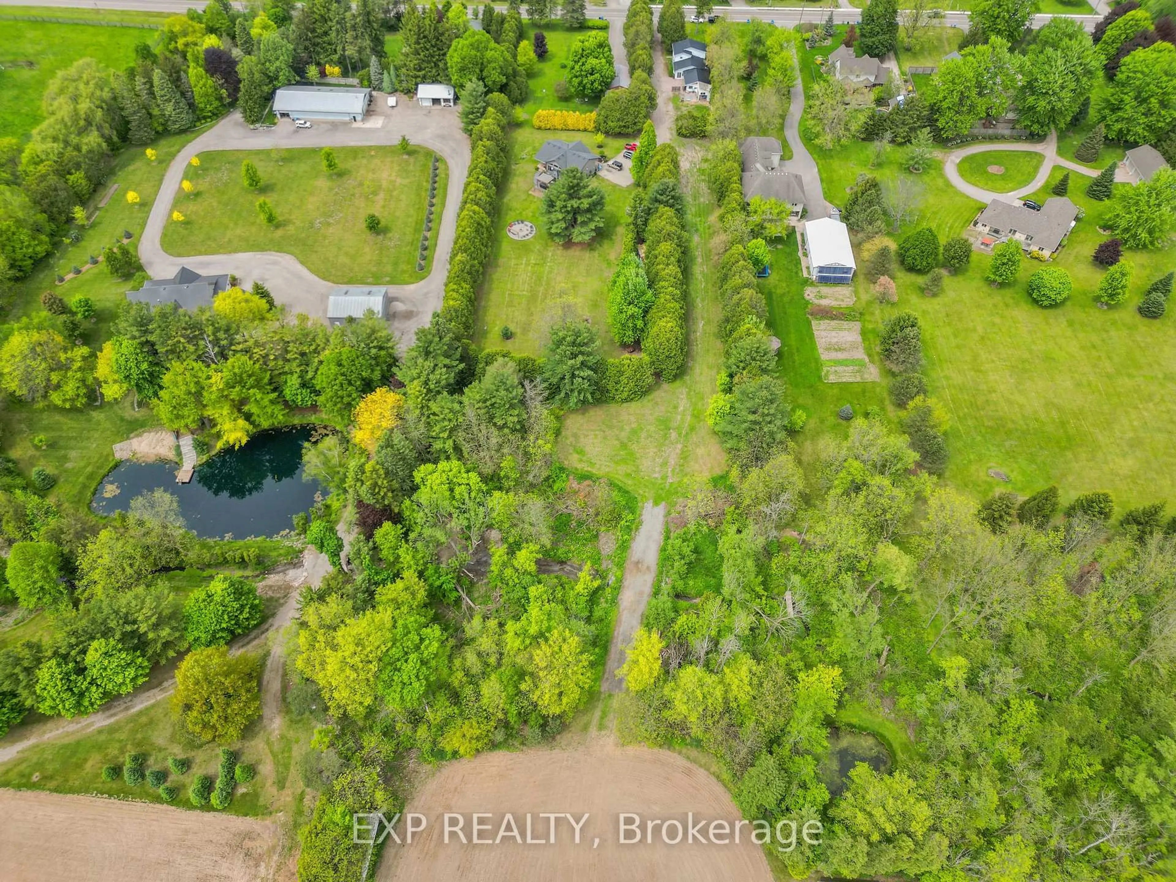 A pic from outside/outdoor area/front of a property/back of a property/a pic from drone, forest/trees view for 3109 Napperton Dr, Adelaide Metcalfe Ontario N7G 3H8