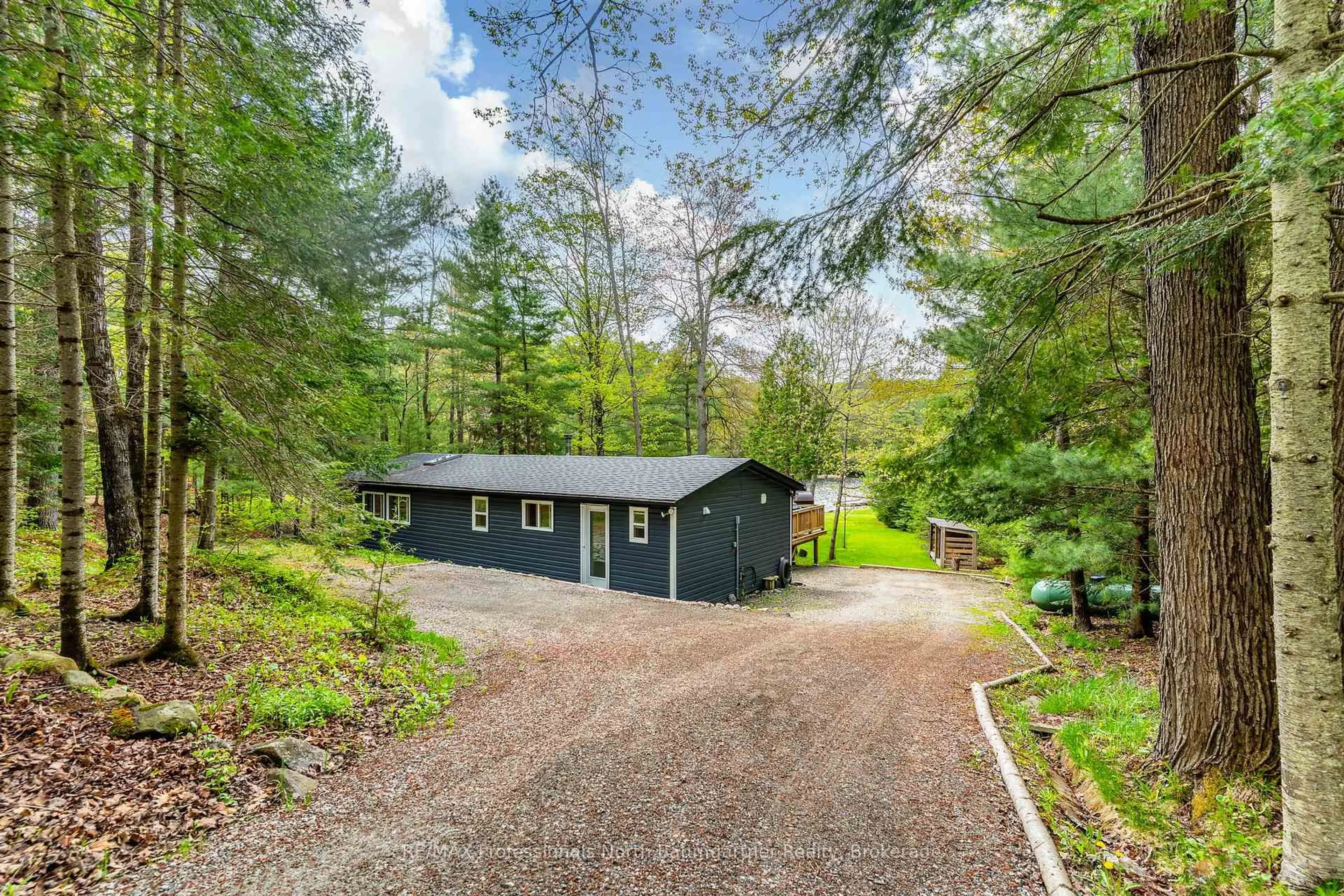 A pic from outside/outdoor area/front of a property/back of a property/a pic from drone, forest/trees view for 2129 Telephone Bay Rd, Highlands East Ontario K0M 1S0
