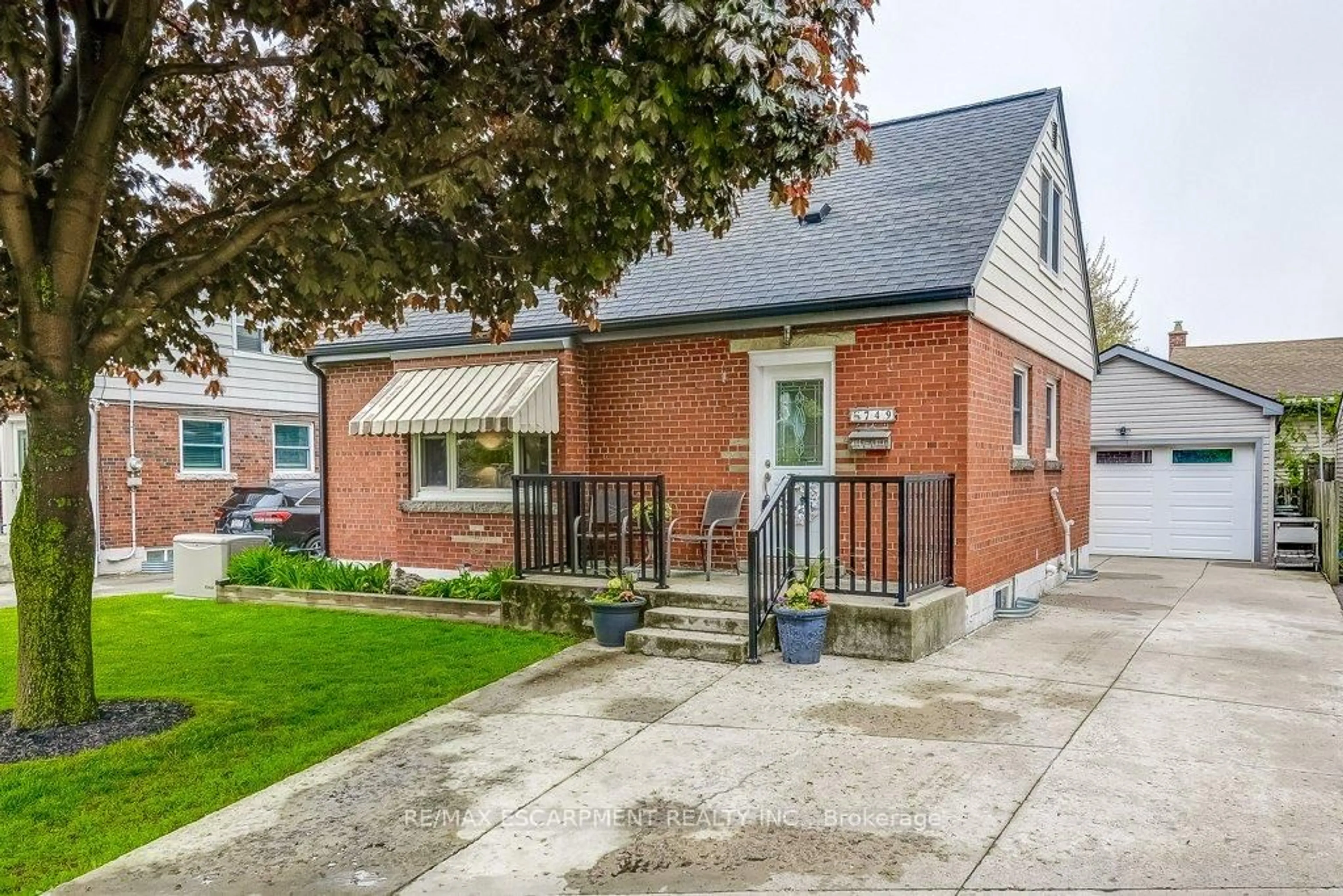 Home with brick exterior material, street for 749 Upper Gage Ave, Hamilton Ontario L8V 4J9